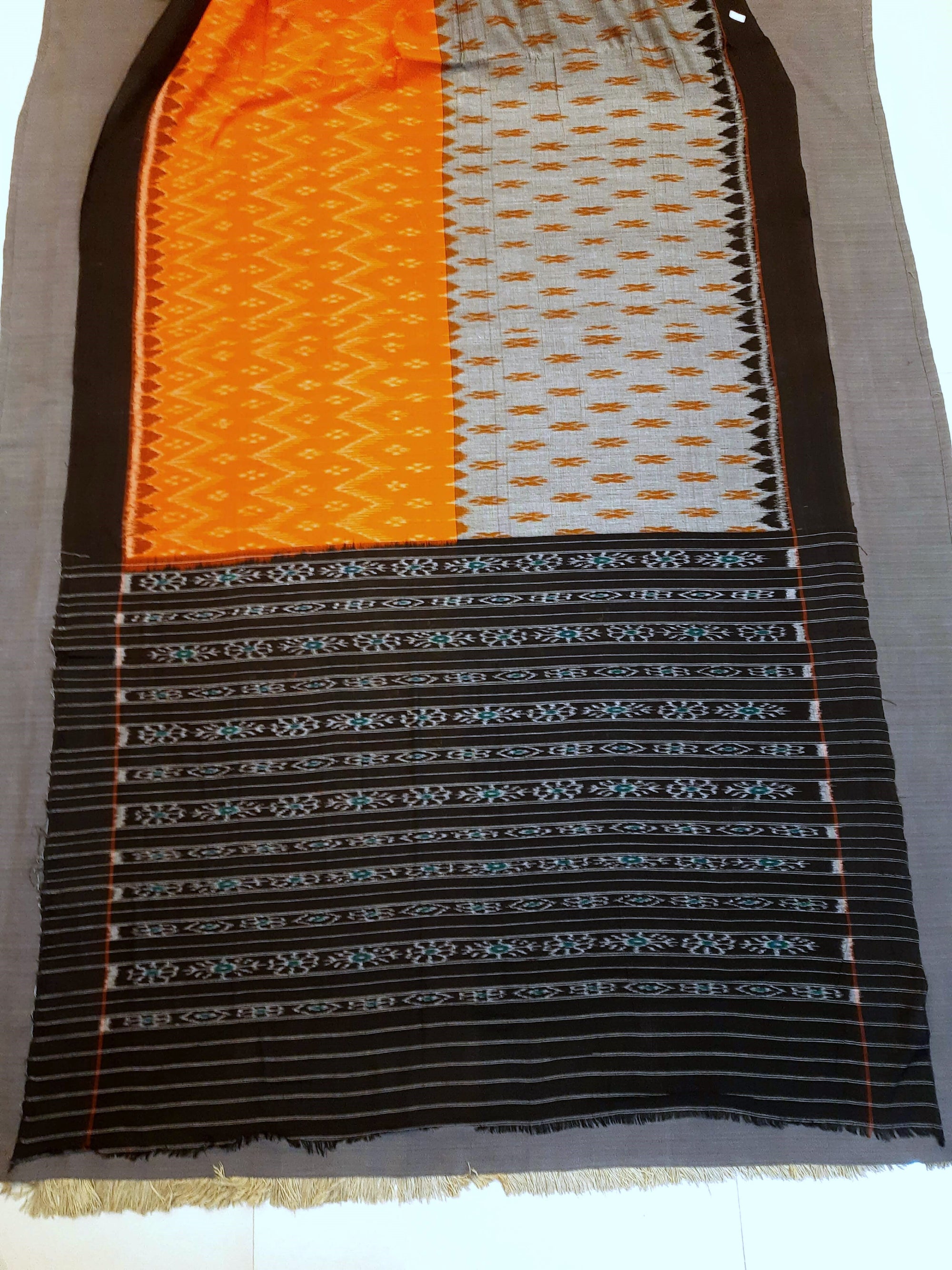 Grey Orange half half colored body Odisha Ikat saree with cotton ikat blouse piece