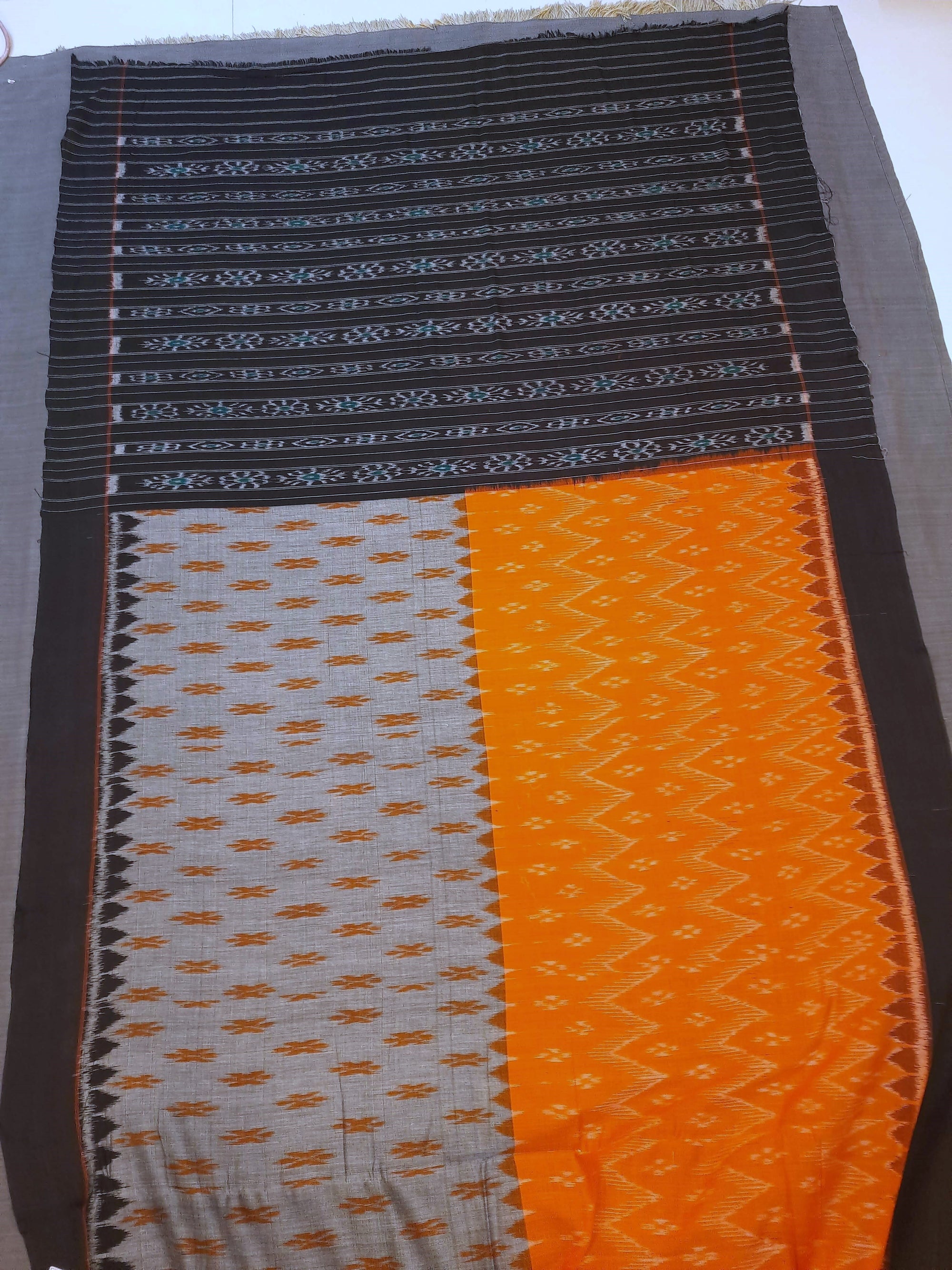 Grey Orange half half colored body Odisha Ikat saree with cotton ikat blouse piece
