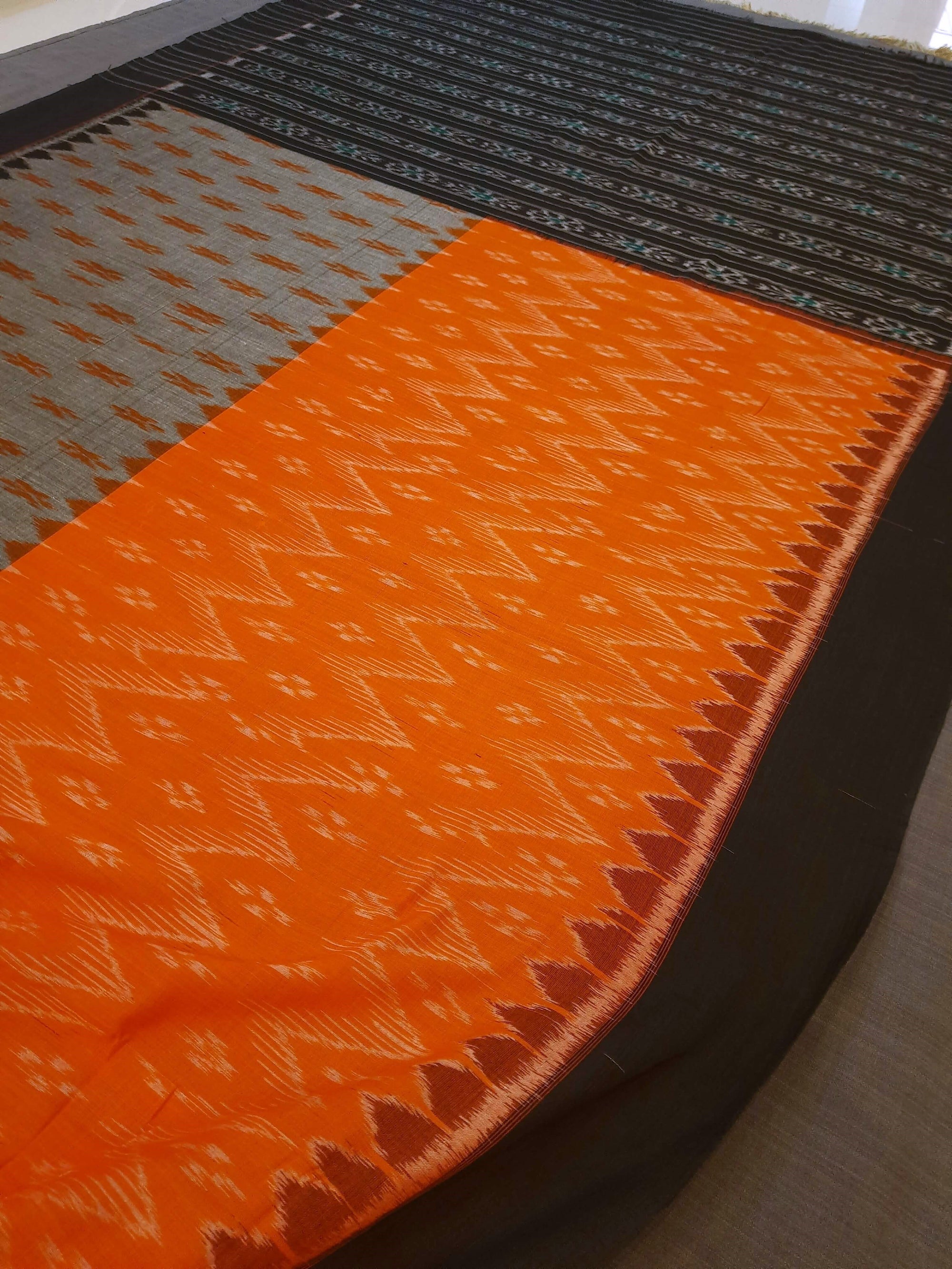 Grey Orange half half colored body Odisha Ikat saree with cotton ikat blouse piece