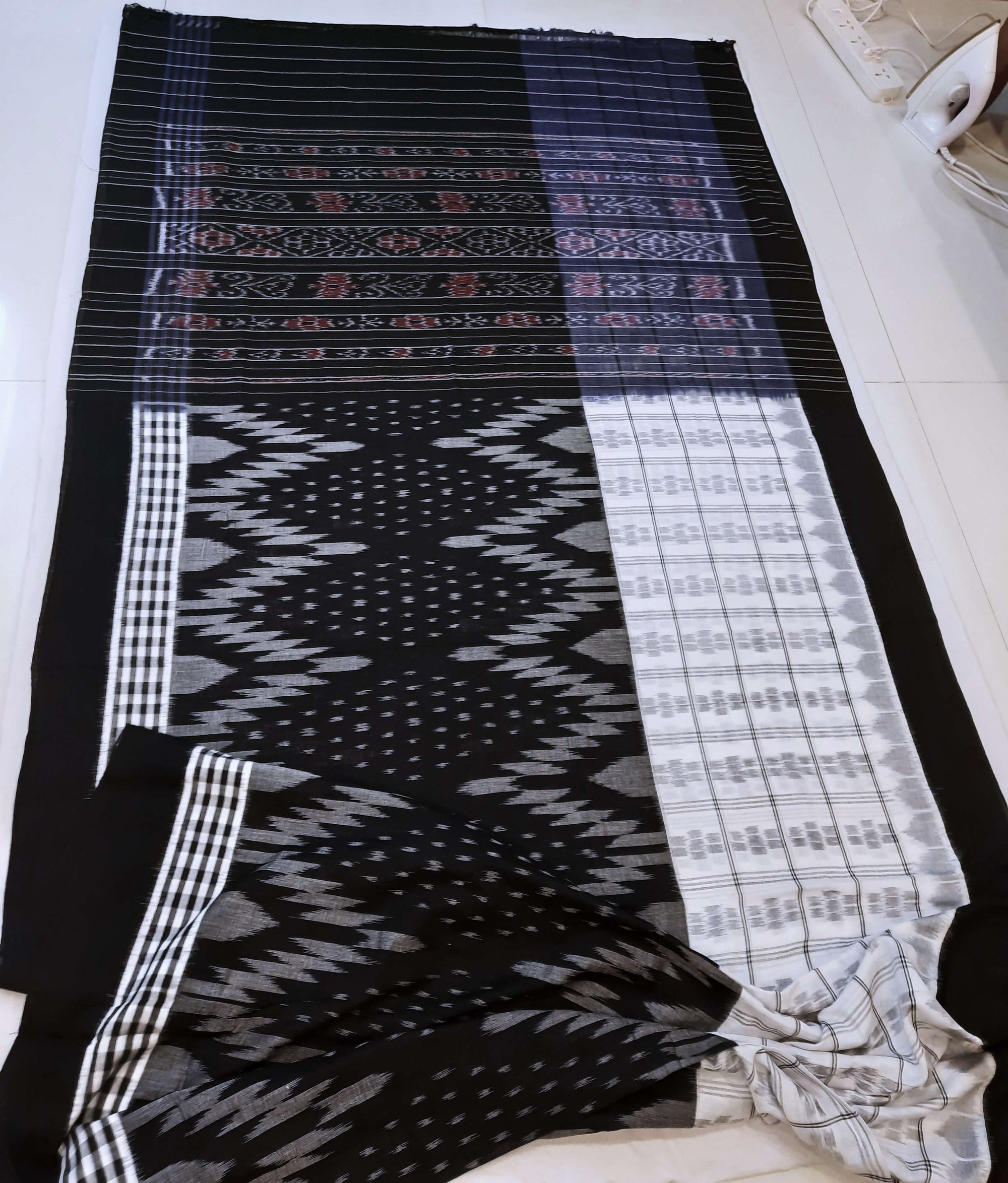 Black and White half half body coloured Odisha Ikat saree with cotton ikat blouse piece