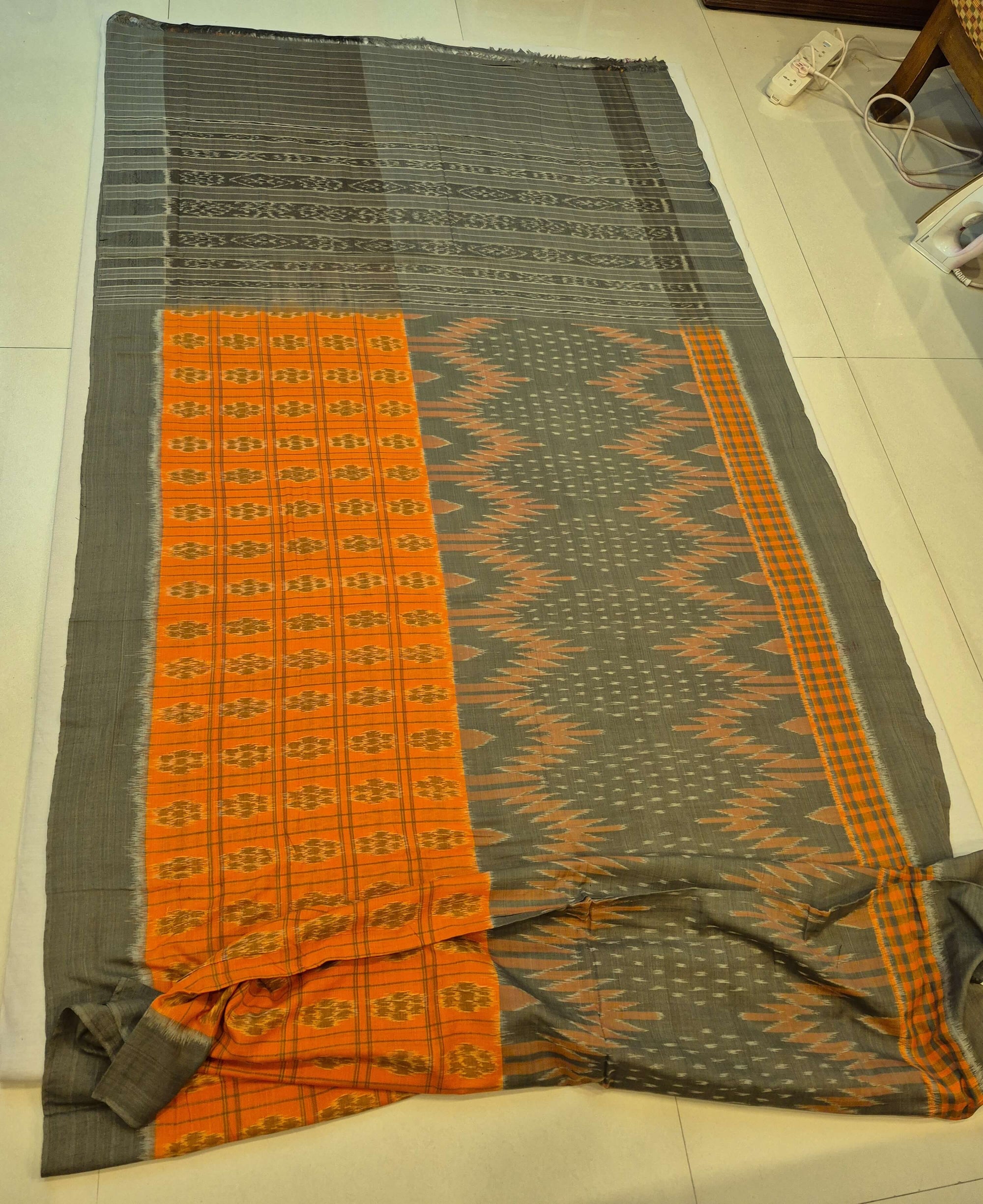Grey Orange half half body coloured Odisha Ikat saree with cotton ikat blouse piece