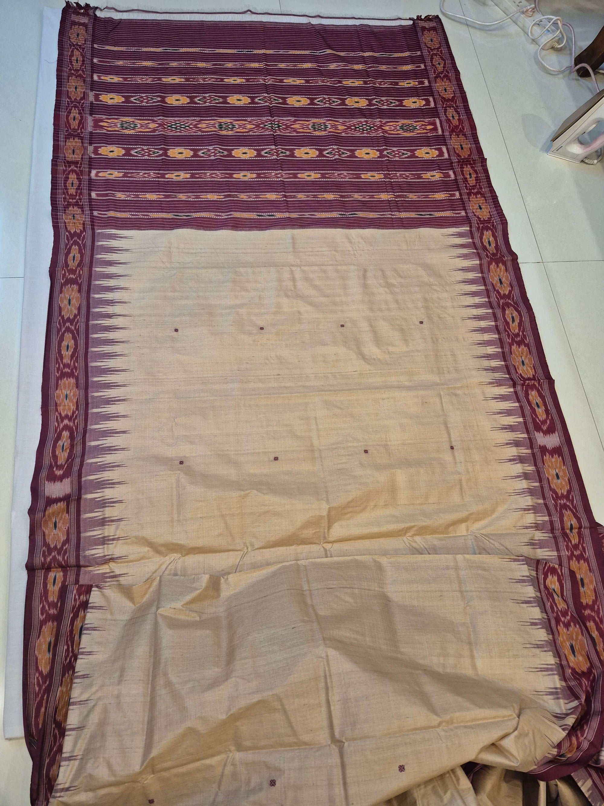 Beige with Maroon Tussar Silk Odisha Ikat Saree paired with cotton ikat blouse piece