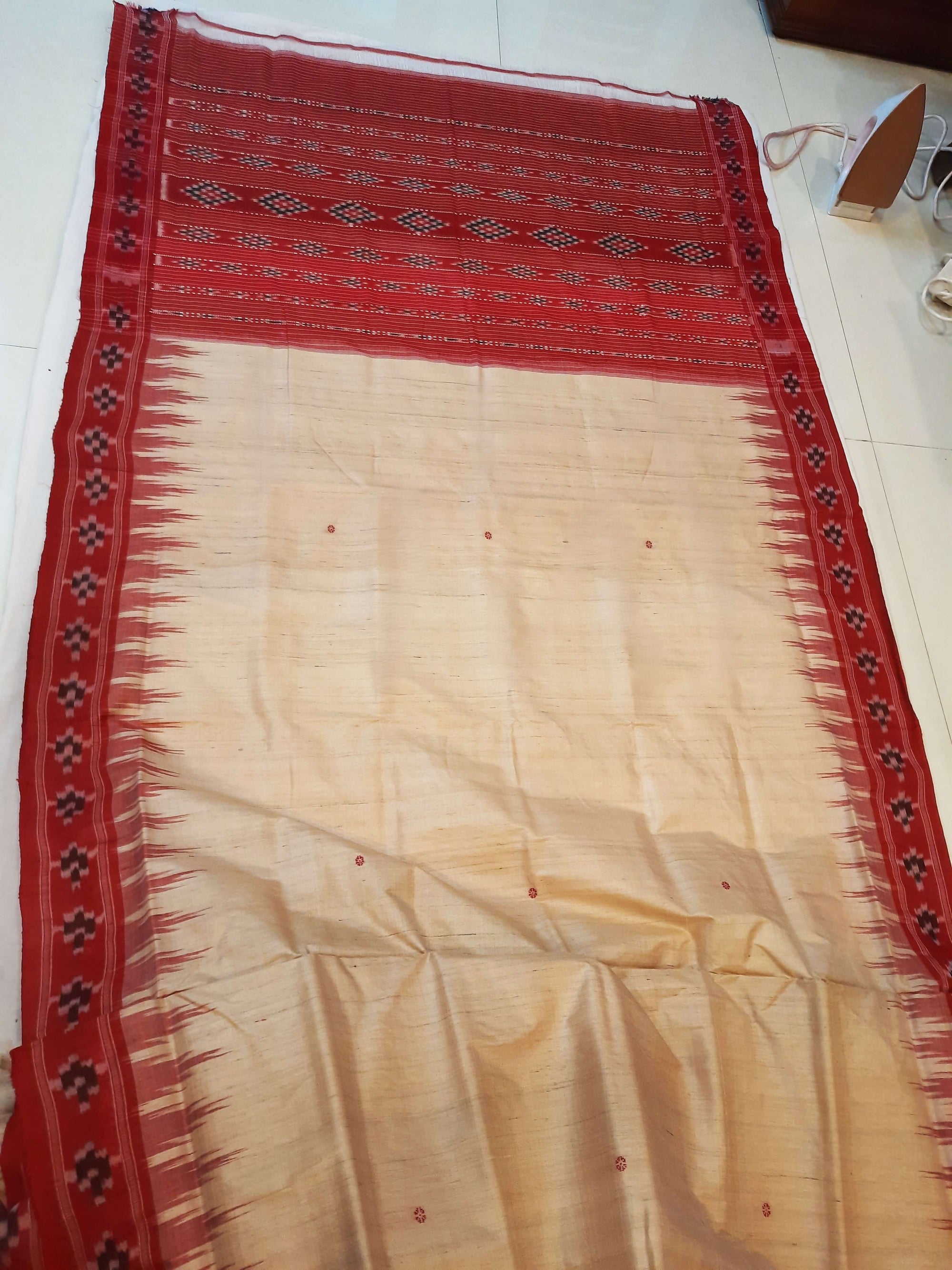 Beige with Red Tussar Silk Odisha Ikat Saree paired with cotton ikat blouse piece