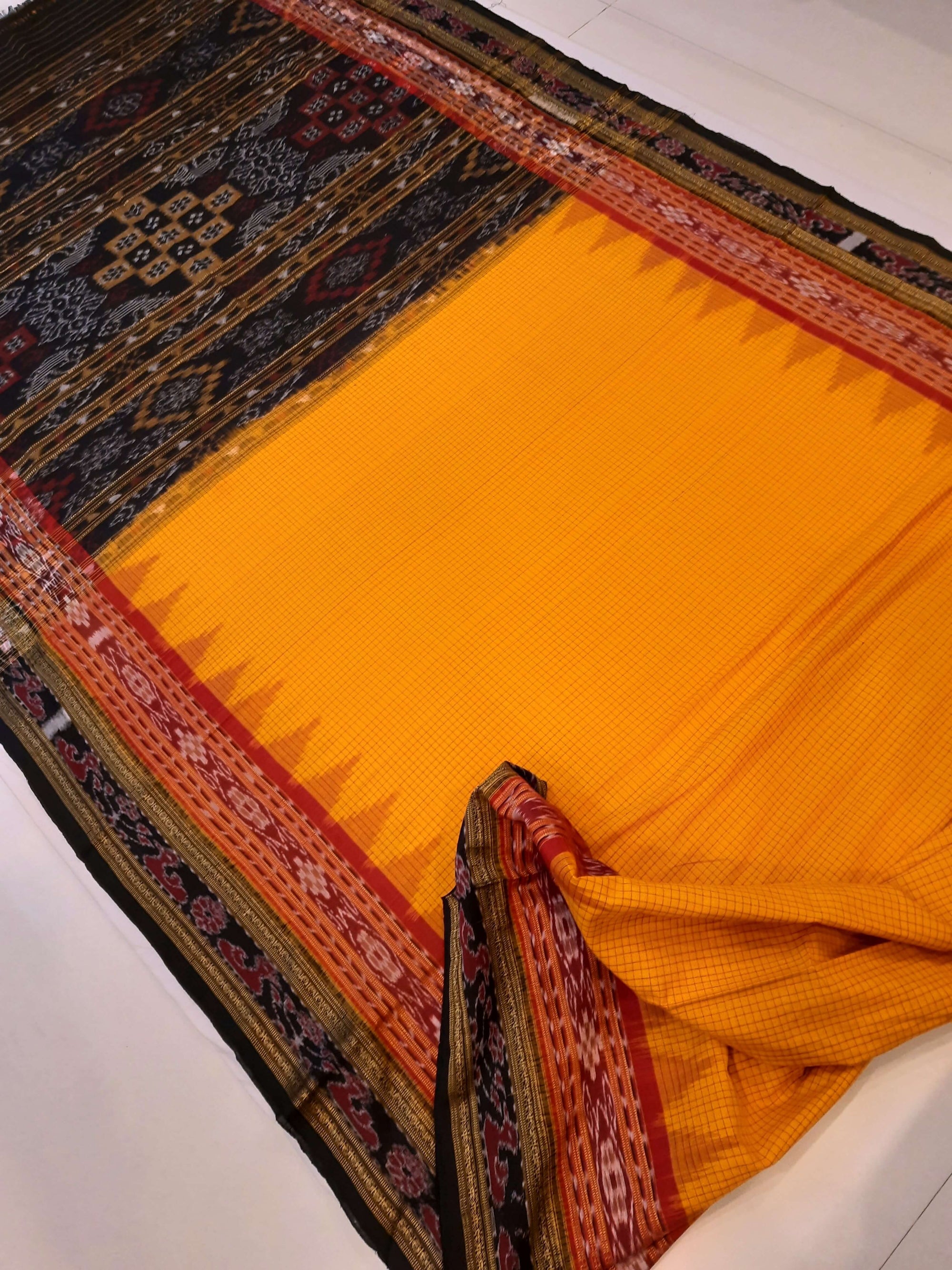 Yellow double order Sachipar Nuapatna Cotton Ikat saree with cotton ikat blouse piece