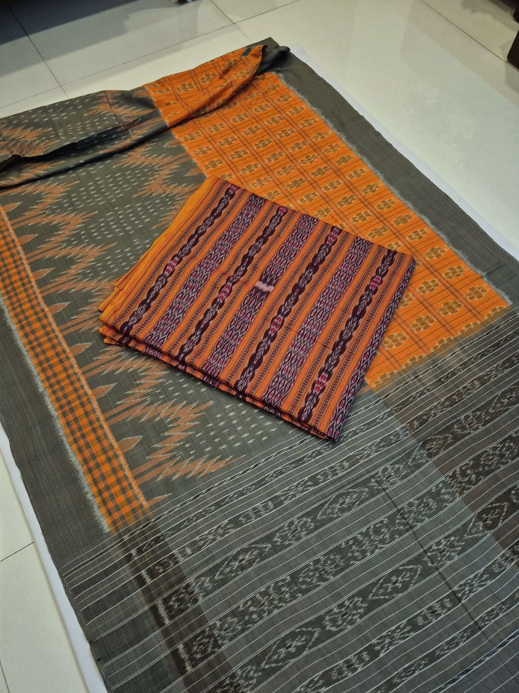 Grey Orange half half body coloured Odisha Ikat saree with cotton ikat blouse piece
