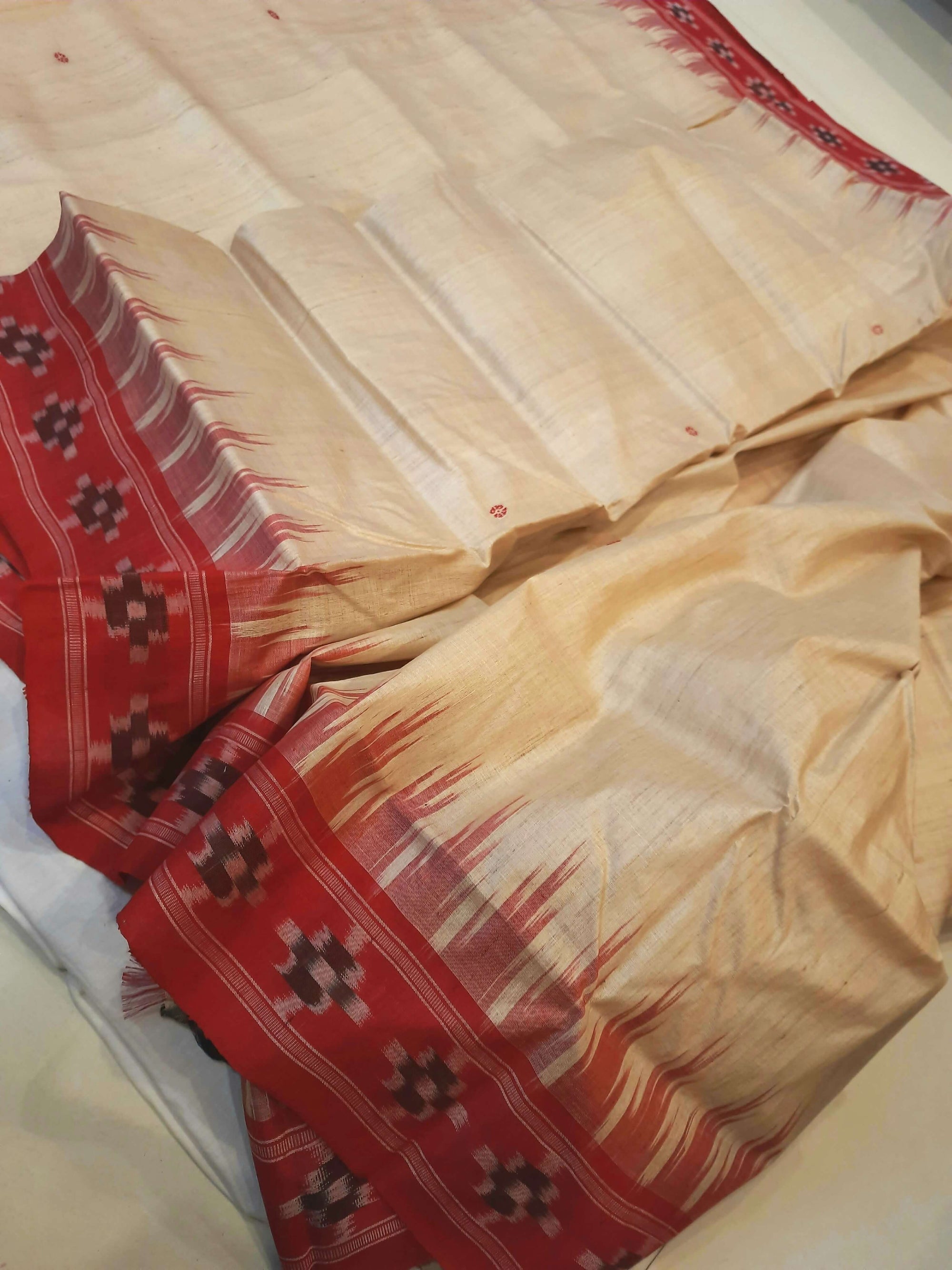 Beige with Red Tussar Silk Odisha Ikat Saree paired with cotton ikat blouse piece