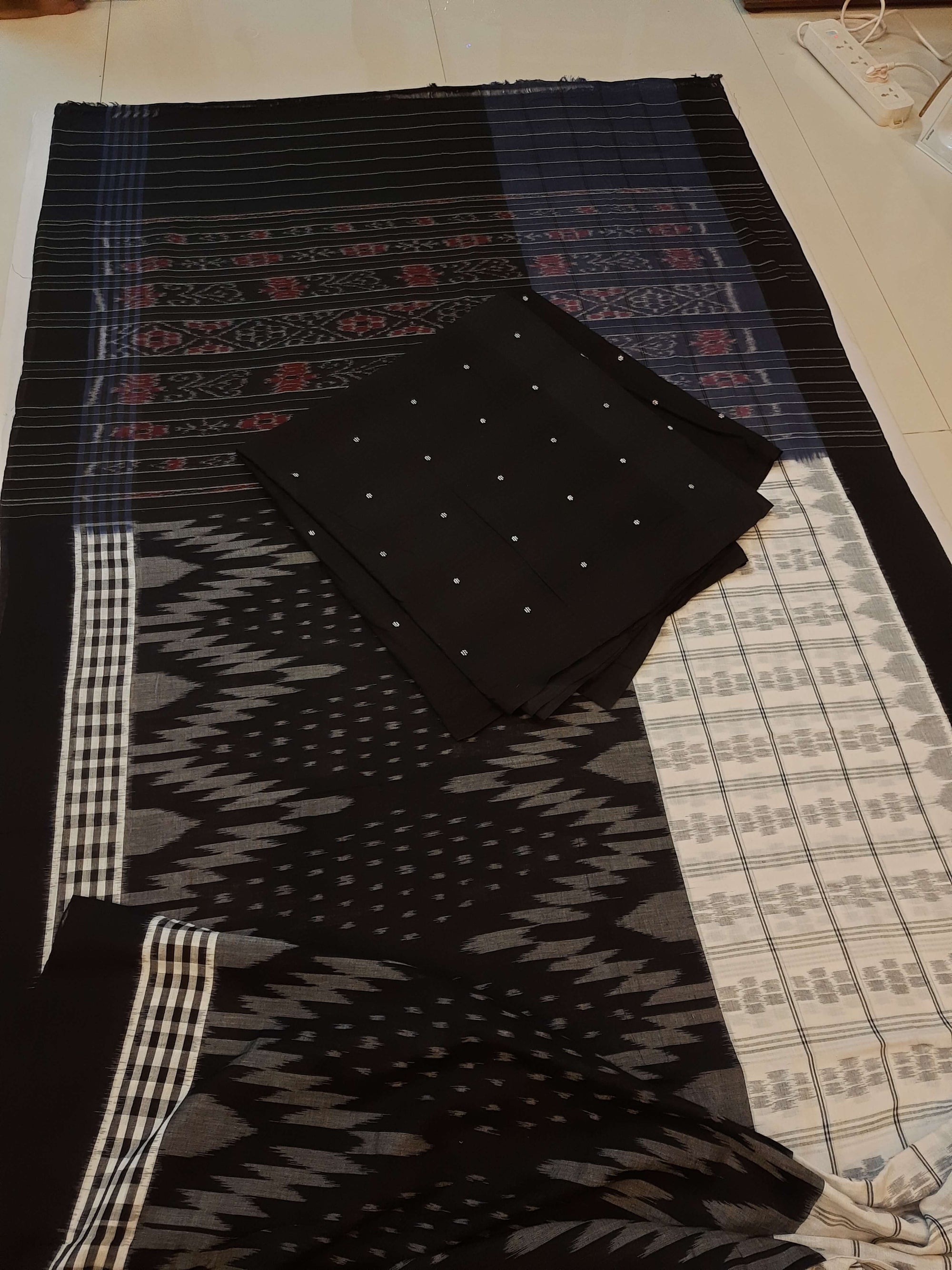 Black and White half half body coloured Odisha Ikat saree with cotton ikat blouse piece