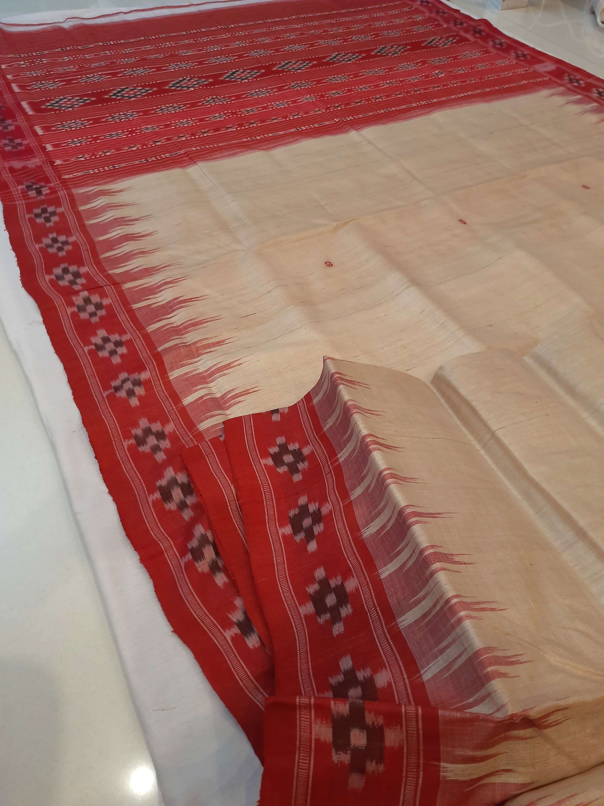 Beige with Red Tussar Silk Odisha Ikat Saree paired with cotton ikat blouse piece