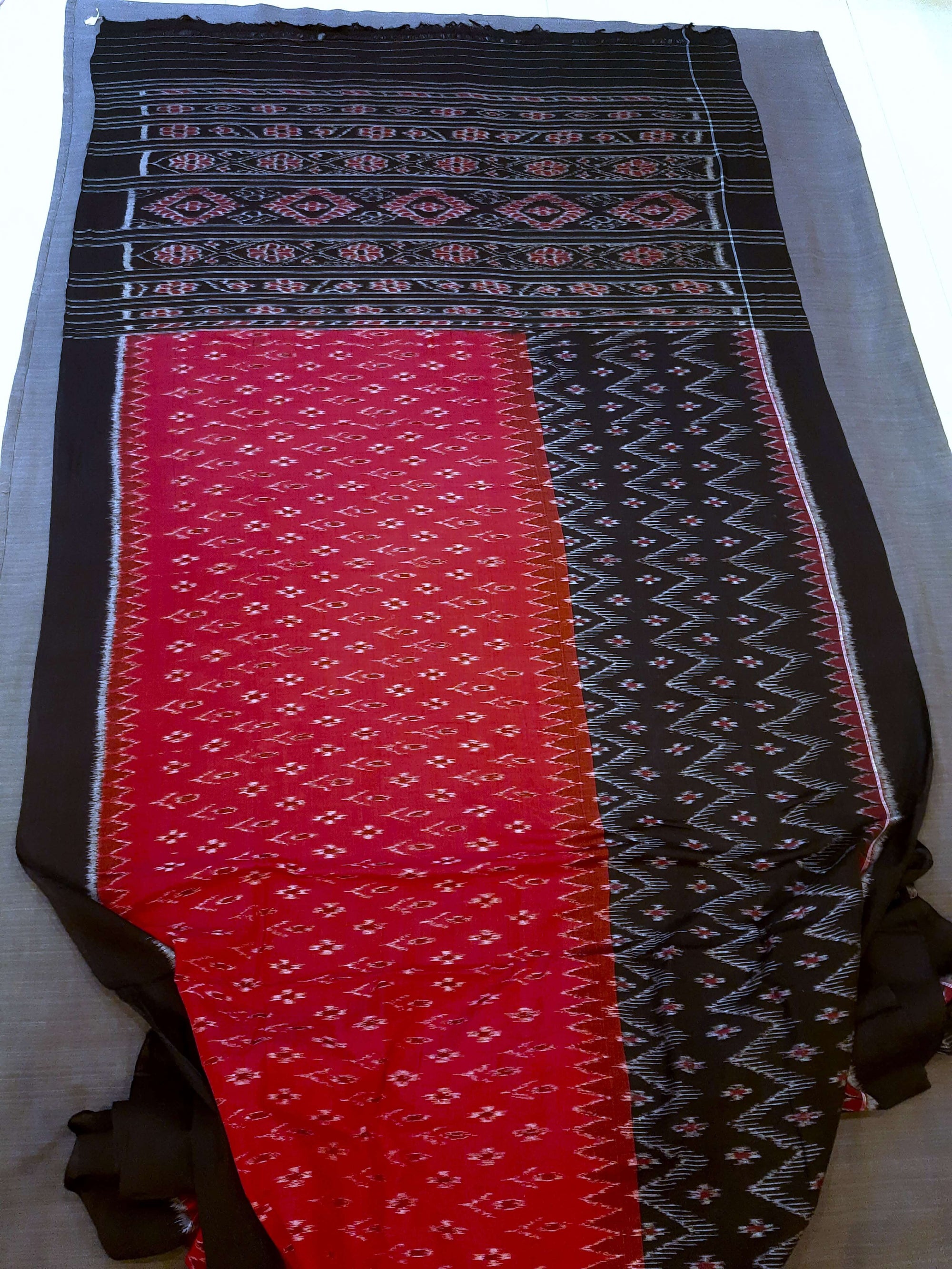 Red and Black Odisha Ikat saree with matching cotton ikat blouse piece