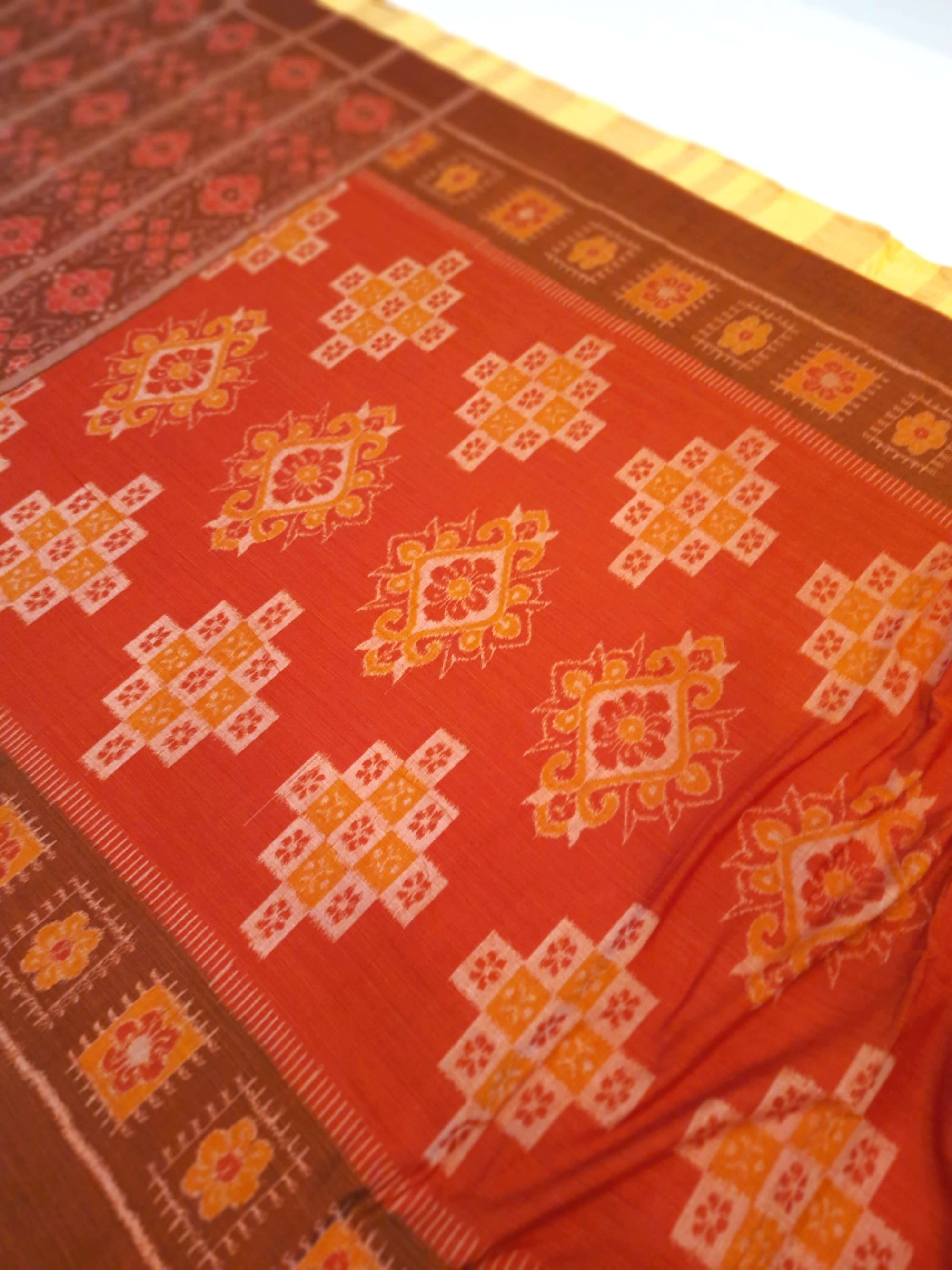 Rust with Brown colour Odisha Ikat saree  with cotton ikat blouse piece