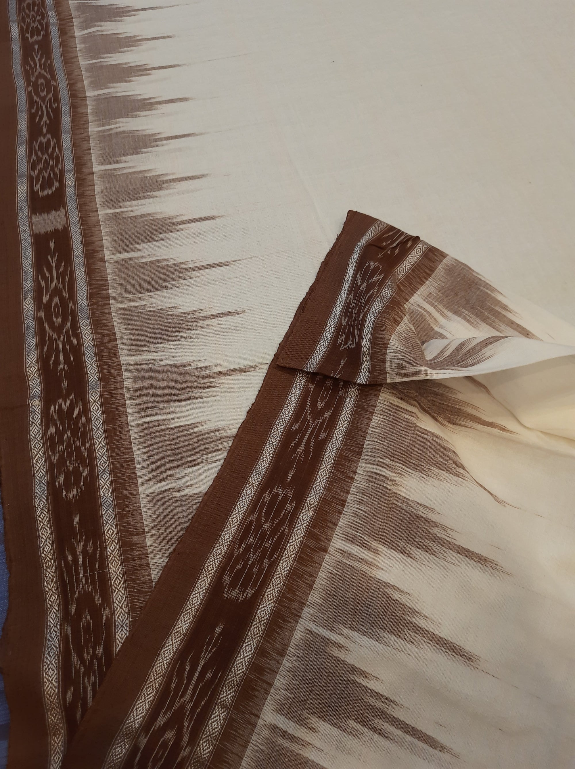 White and Brown coloured Odisha Ikat saree  with cotton ikat blouse piece