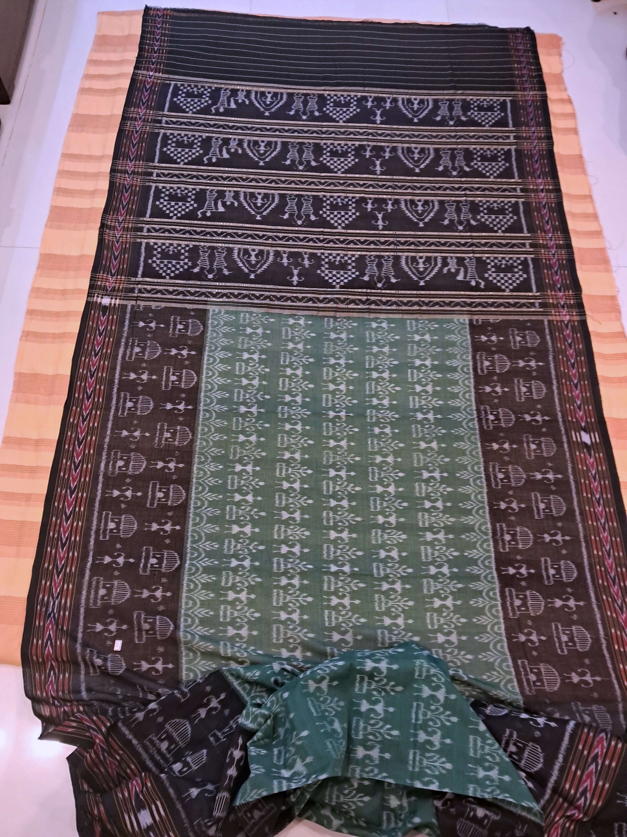 Green woven tribal motif Odisha Ikat saree  with cotton ikat blouse piece