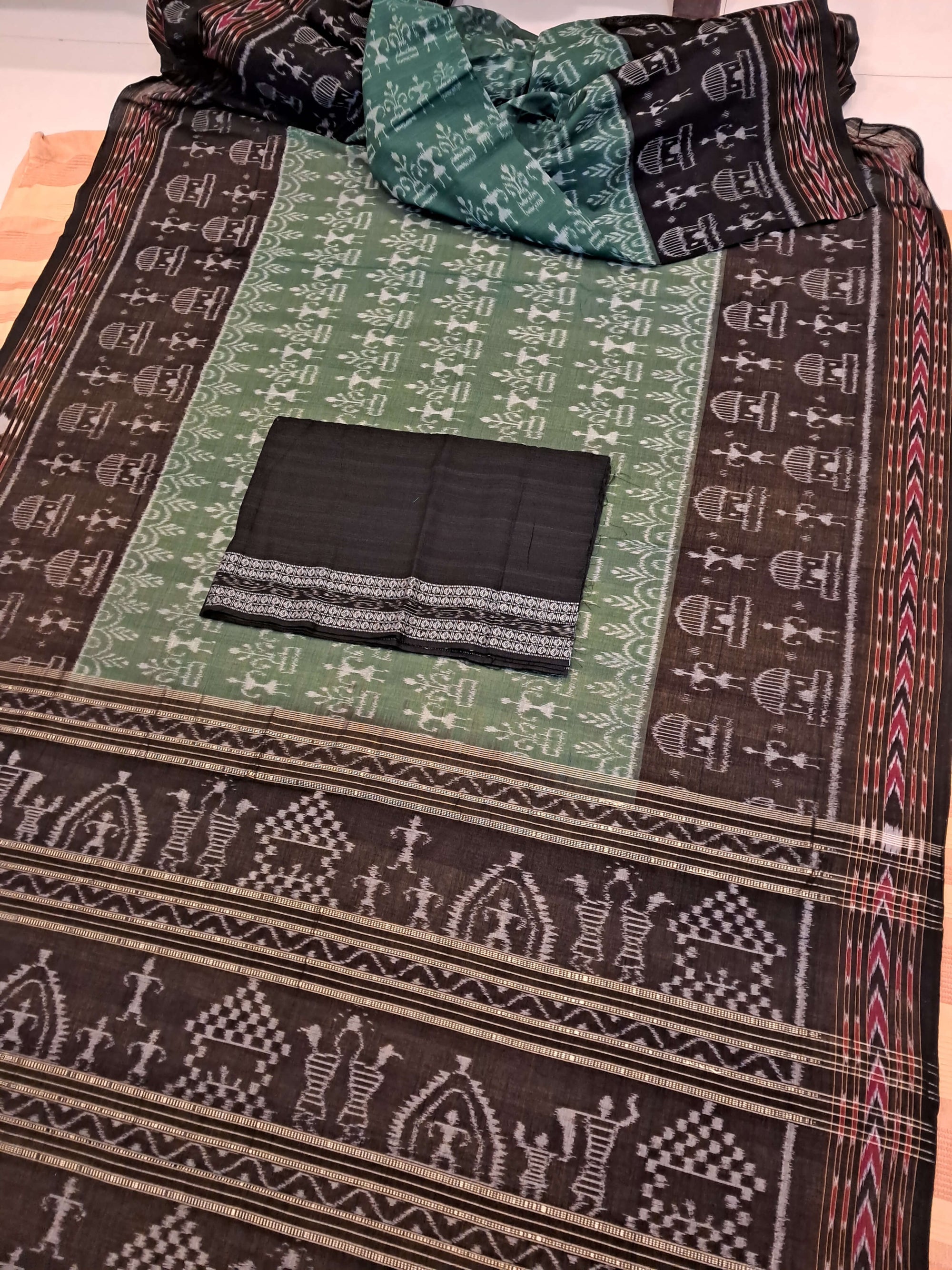 Green woven tribal motif Odisha Ikat saree  with cotton ikat blouse piece