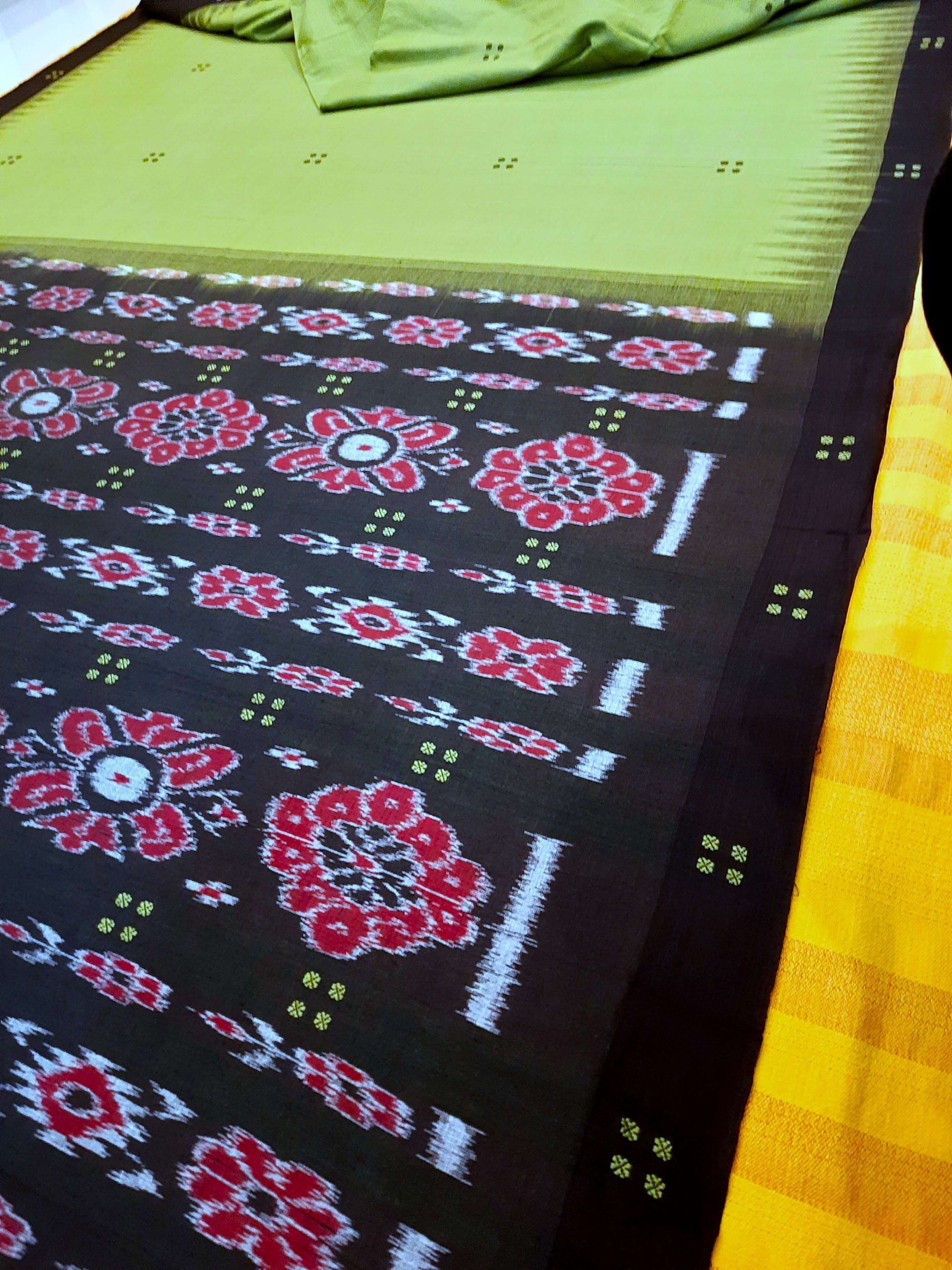 Green with black coloured Odisha Ikat saree  with cotton ikat blouse piece