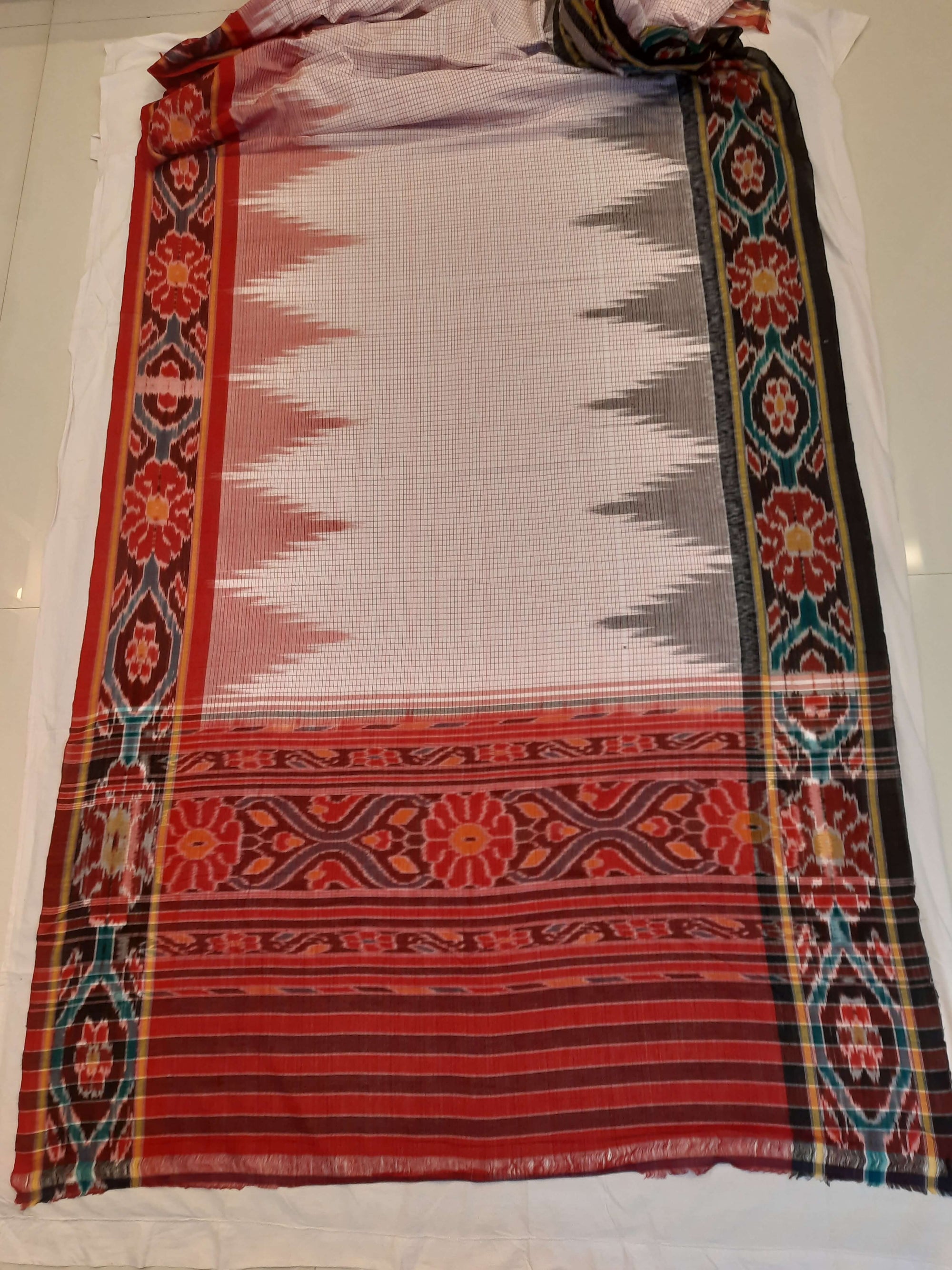 Beige checked body Cotton Odisha Ikat saree with mix match cotton ikat blouse