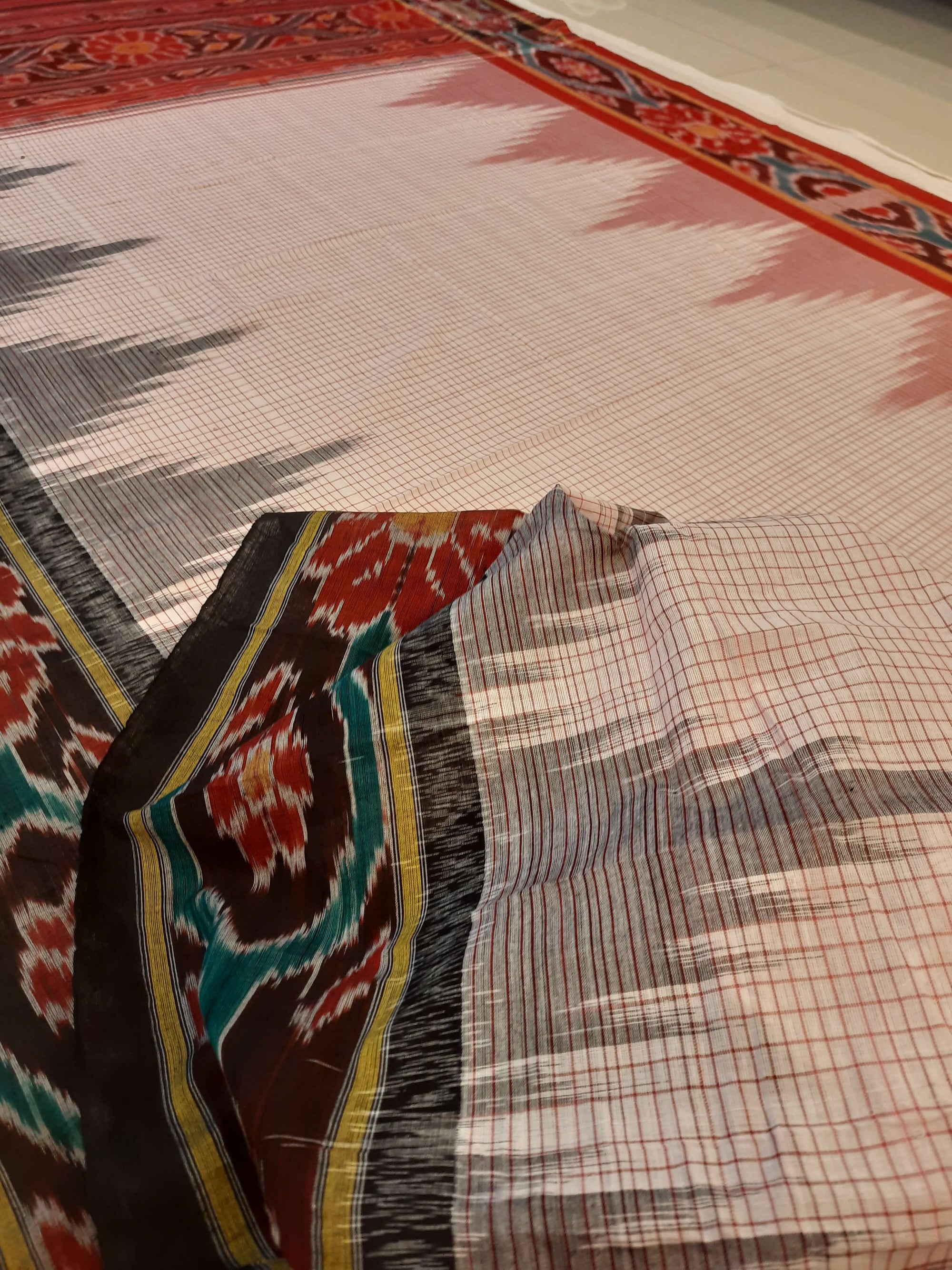 Beige checked body Cotton Odisha Ikat saree with mix match cotton ikat blouse