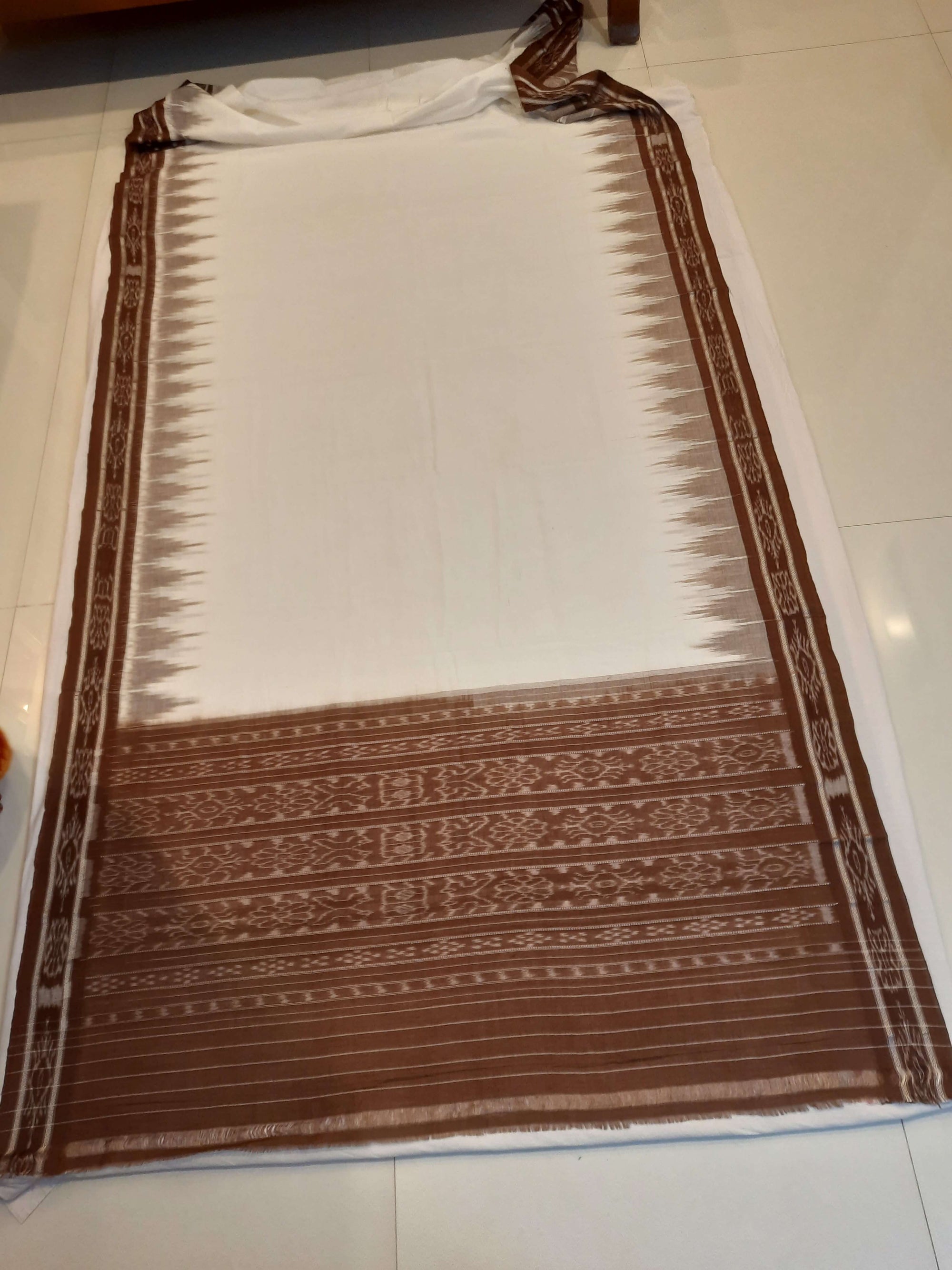 White and Brown coloured Odisha Ikat saree  with cotton ikat blouse piece