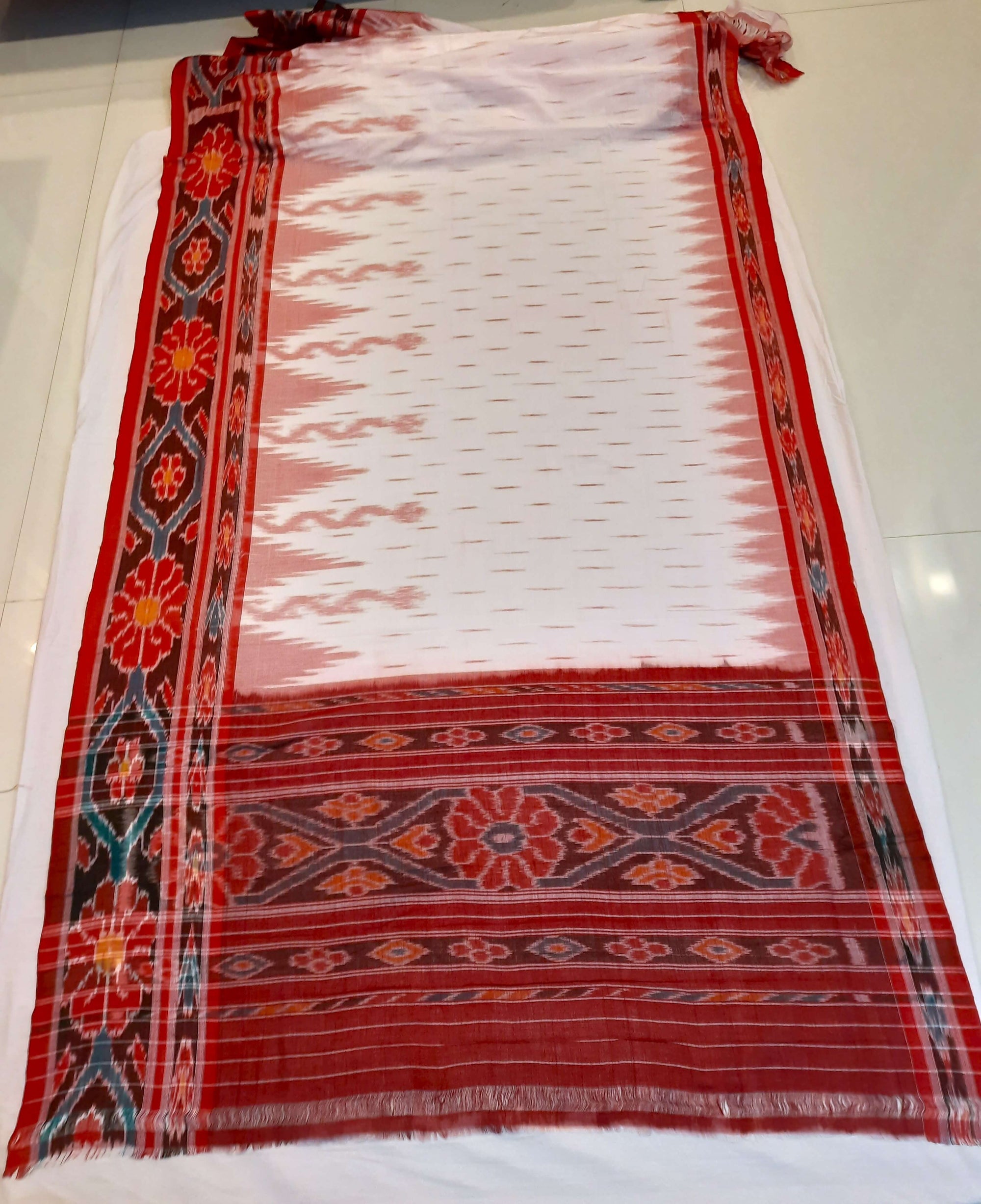 White with Red Cotton Odisha Ikat saree with cotton ikat blouse piece