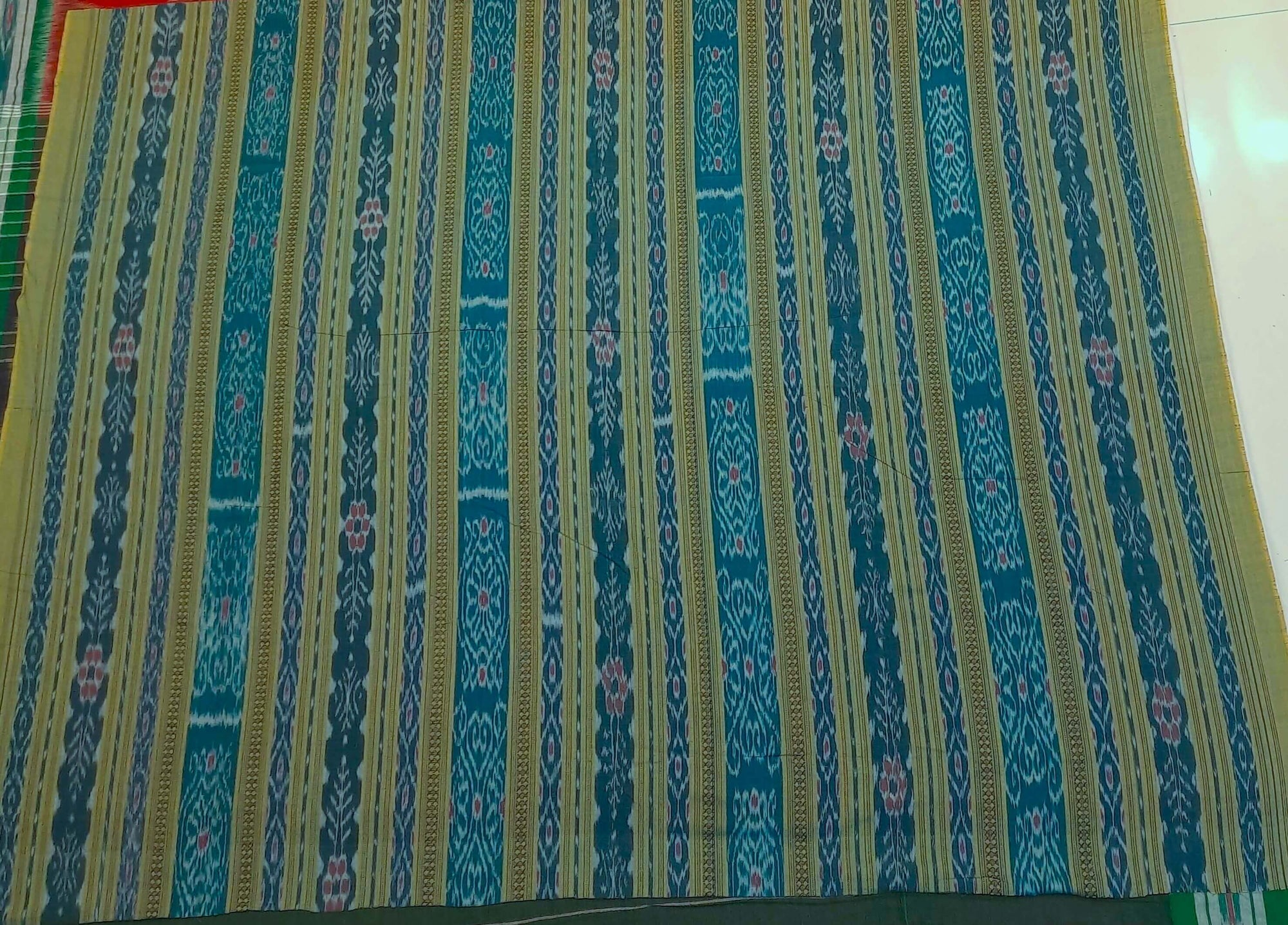 White with Green Odisha Ikat saree with cotton ikat blouse piece