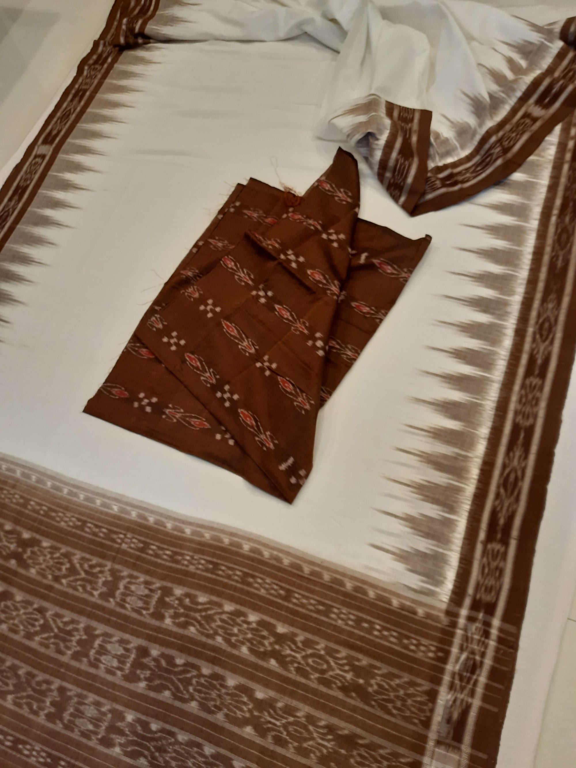 White and Brown coloured Odisha Ikat saree  with cotton ikat blouse piece