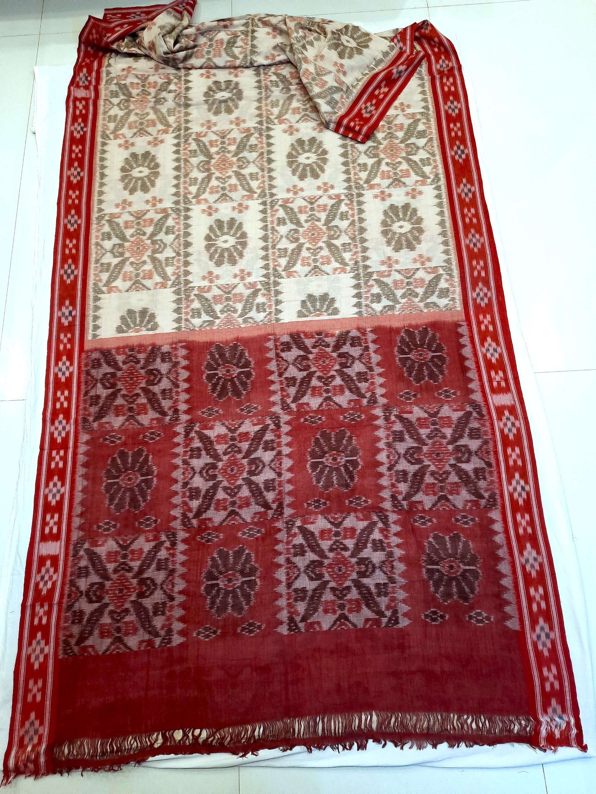 Beige and Red coloured Odisha Ikat saree  with cotton ikat blouse piece