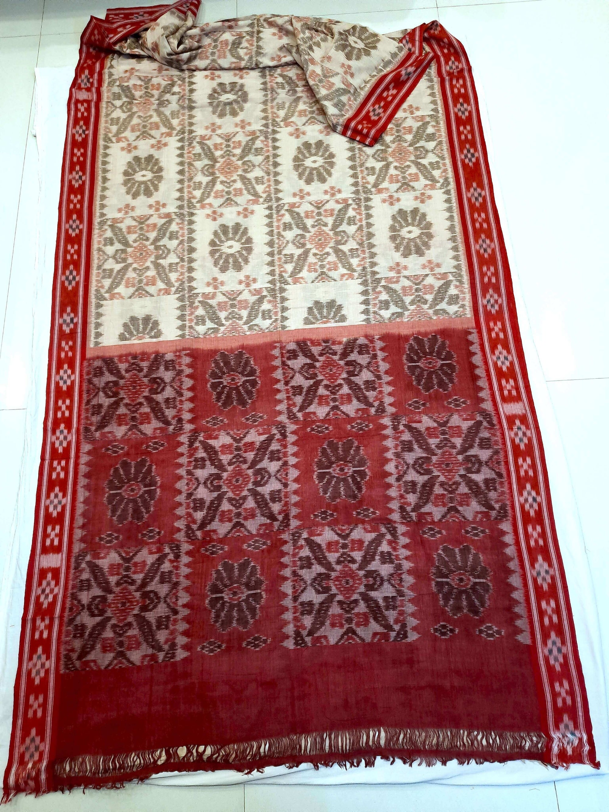 Beige and Red coloured Odisha Ikat saree  with cotton ikat blouse piece