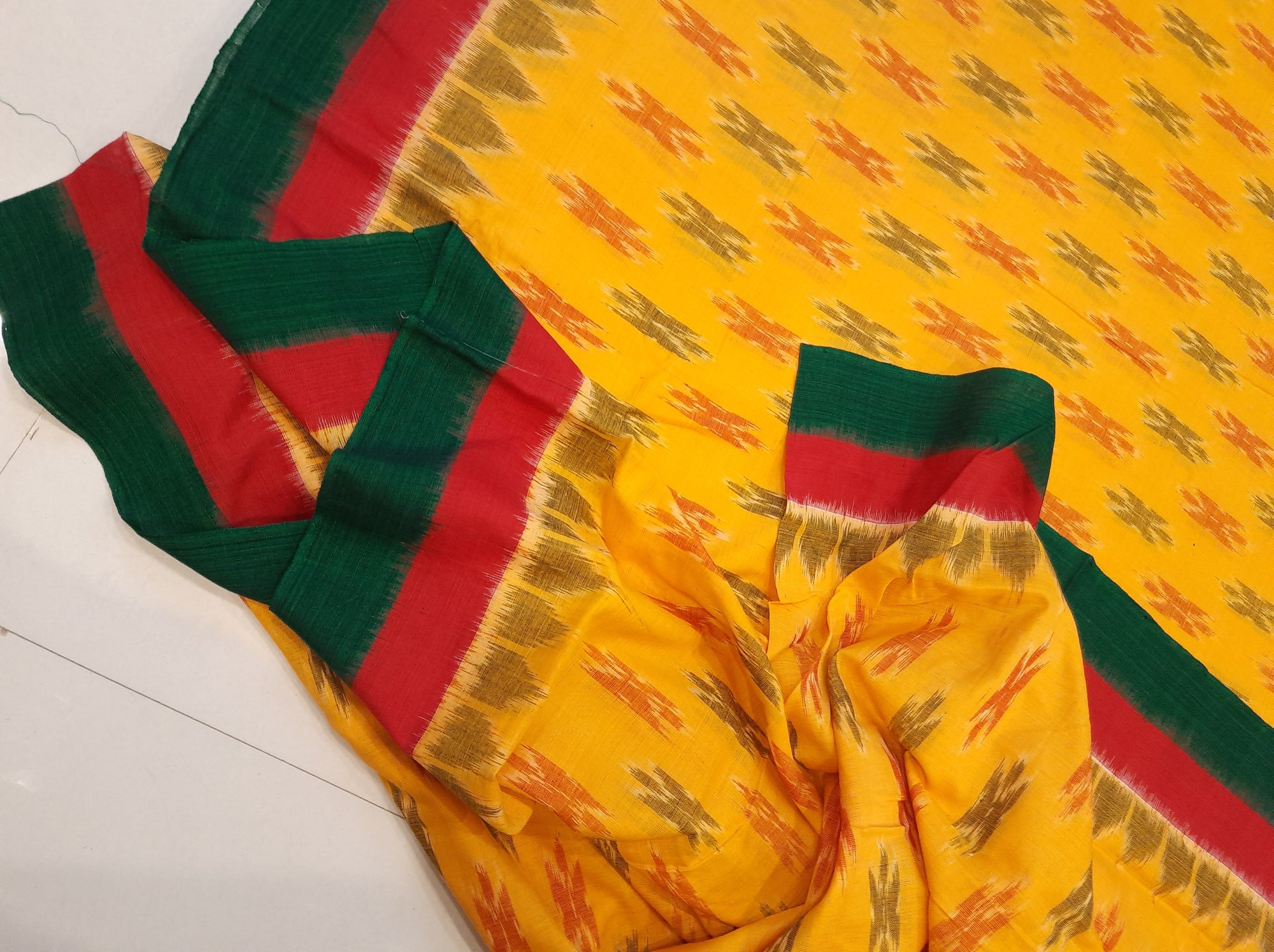 Yellow Cotton Odisha Ikat saree with cotton ikat blouse piece