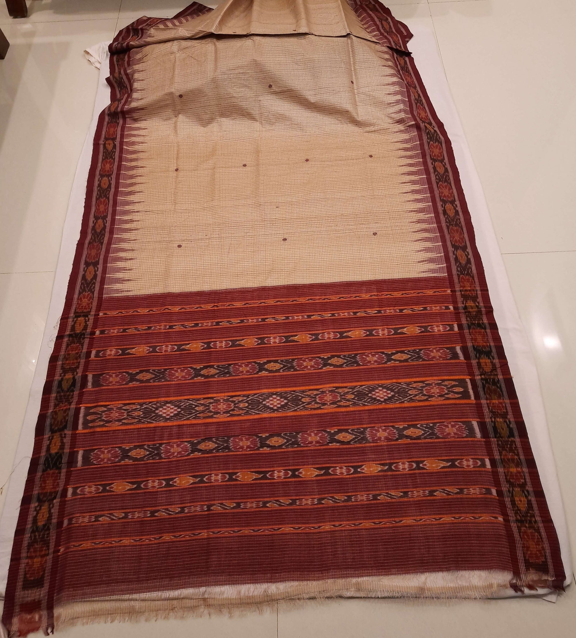 Beige checkered body Tussar Silk Odisha Ikat Saree with cotton ikat blouse piece