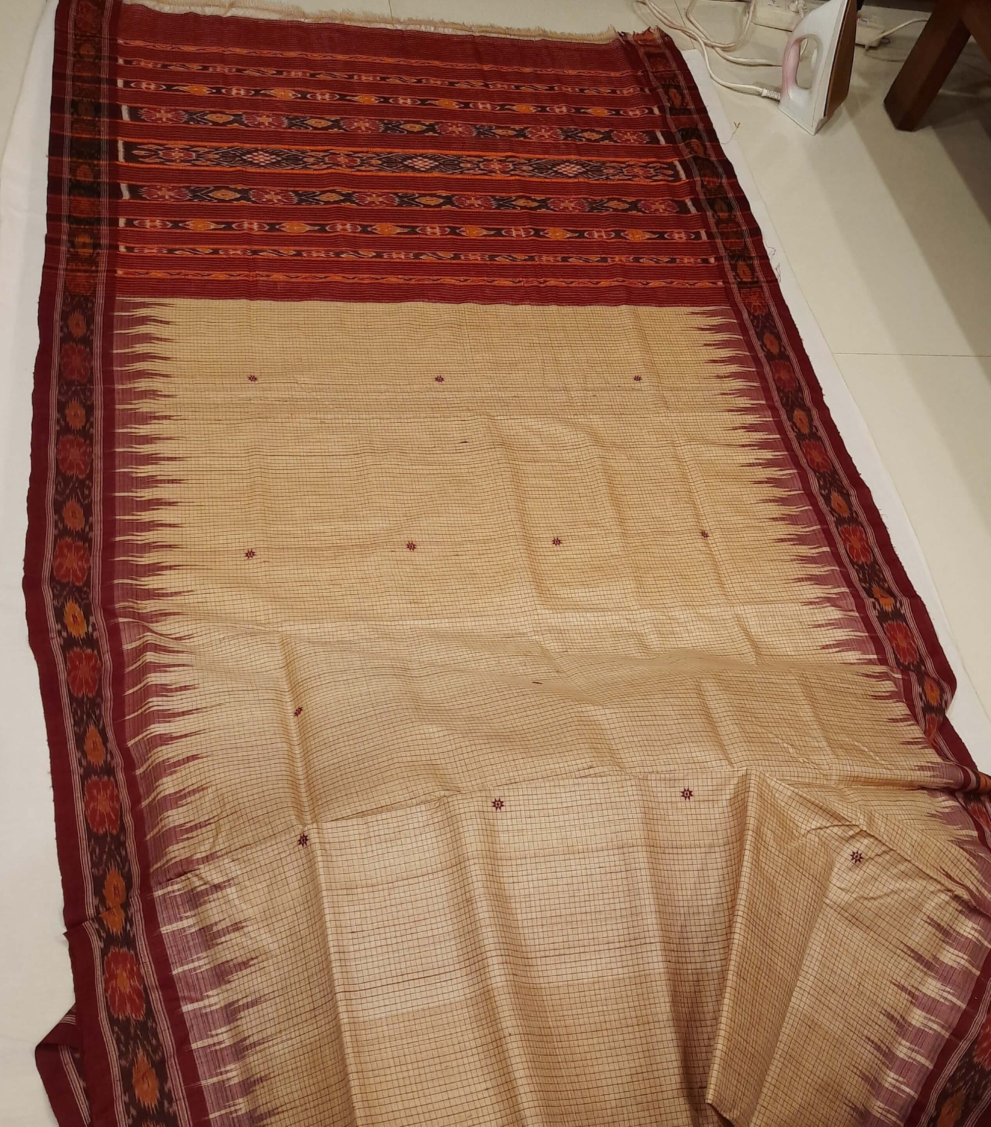Beige checkered body Tussar Silk Odisha Ikat Saree with cotton ikat blouse piece