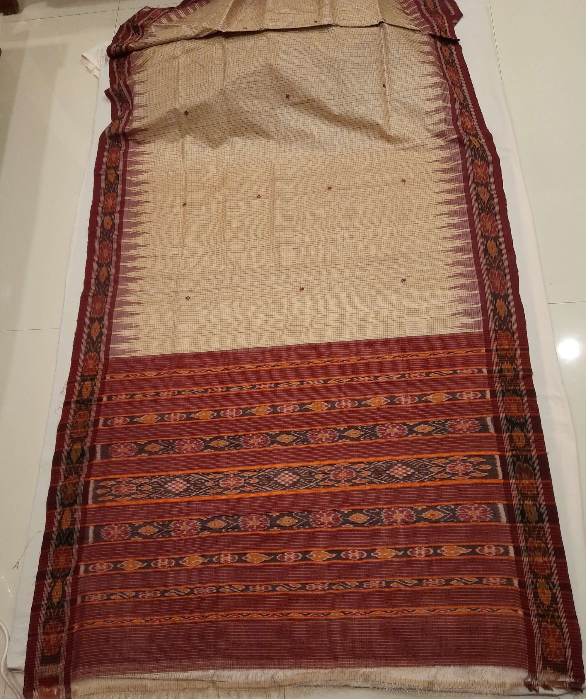 Beige checkered body Tussar Silk Odisha Ikat Saree with cotton ikat blouse piece