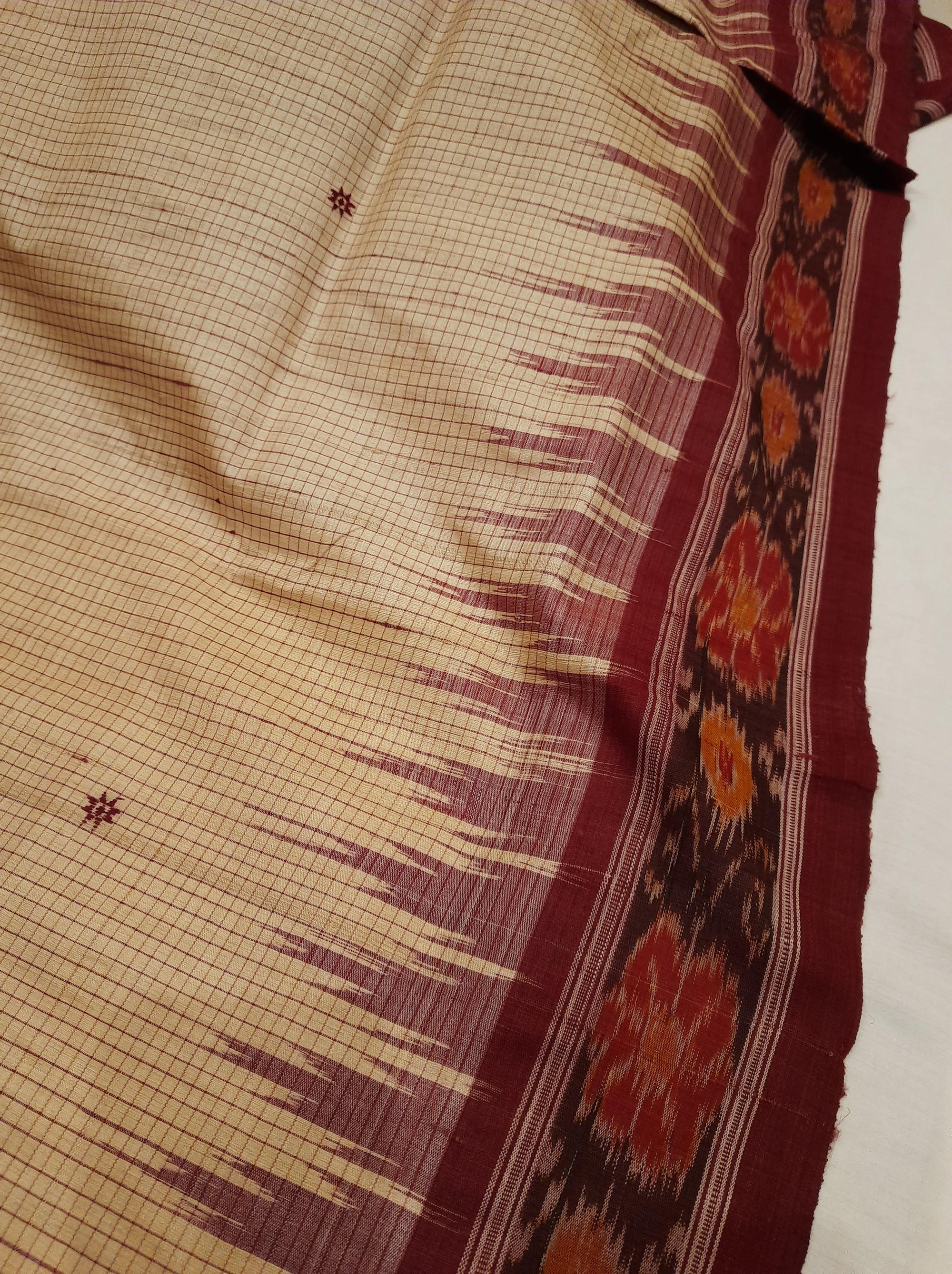Beige checkered body Tussar Silk Odisha Ikat Saree with cotton ikat blouse piece