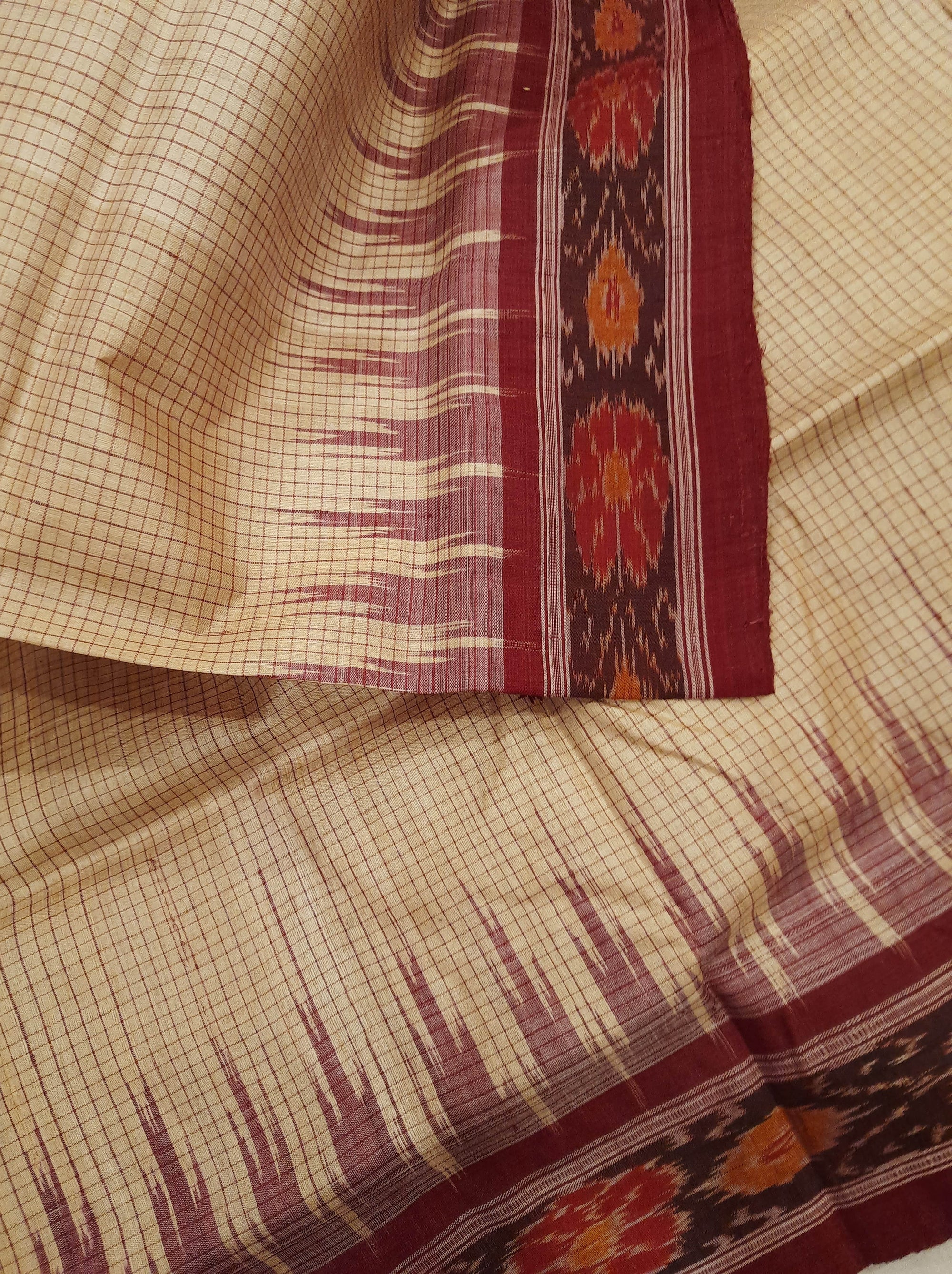Beige checkered body Tussar Silk Odisha Ikat Saree with cotton ikat blouse piece