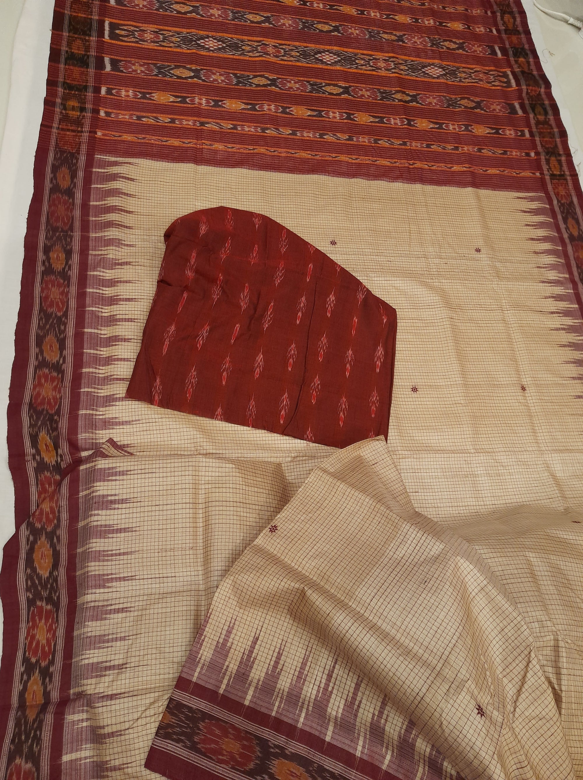 Beige checkered body Tussar Silk Odisha Ikat Saree with cotton ikat blouse piece