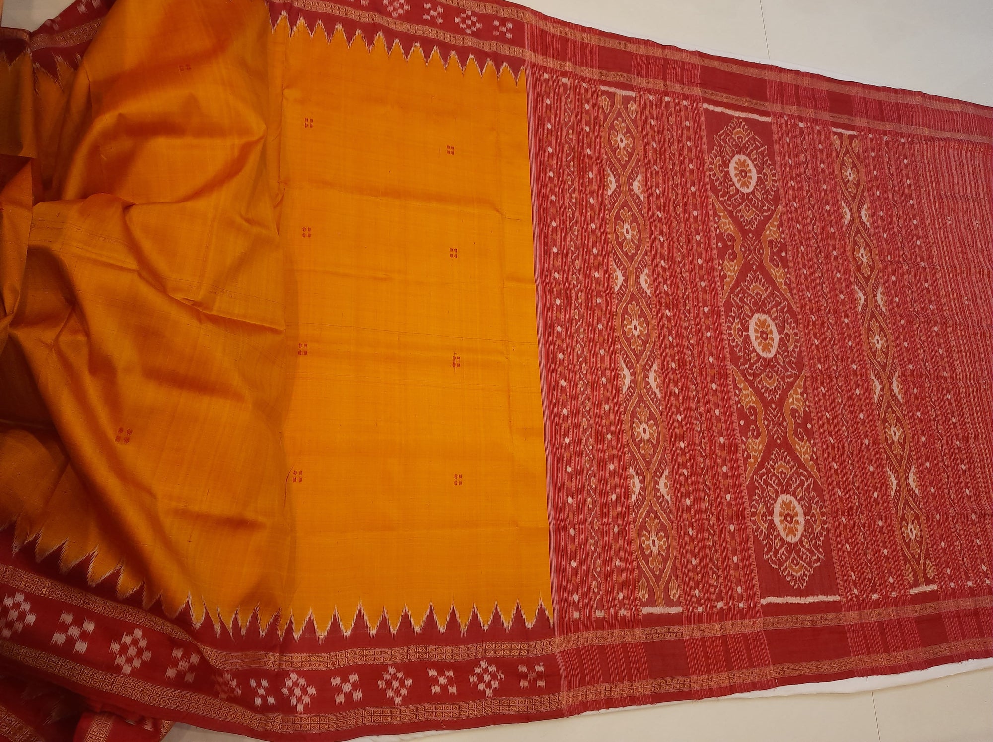 Golden Odisha Khandua Pata Silk Saree paired with cotton ikat blouse piece