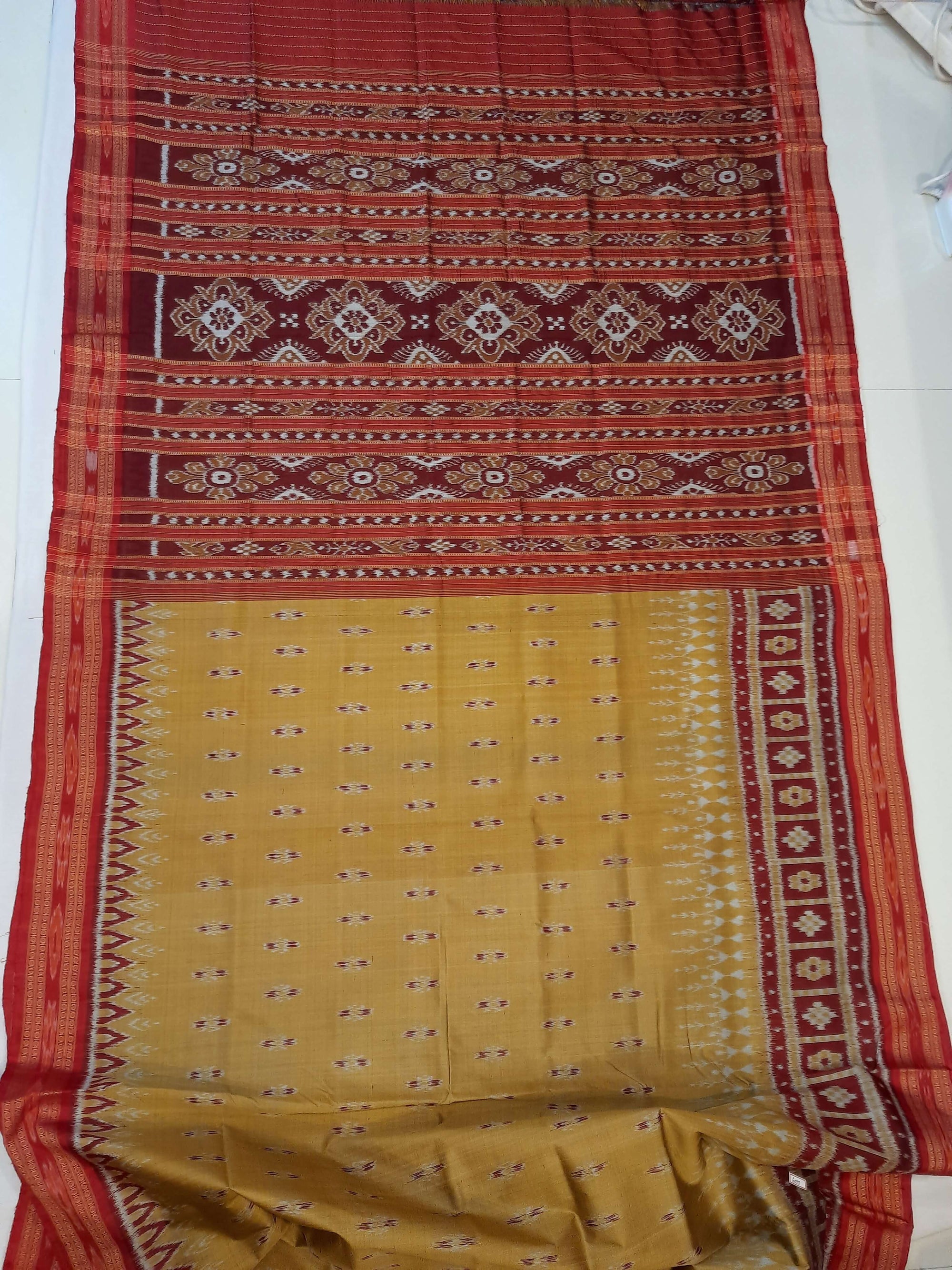 Golden wide border Odisha Khandua Pata Silk Saree paired with cotton ikat blouse piece