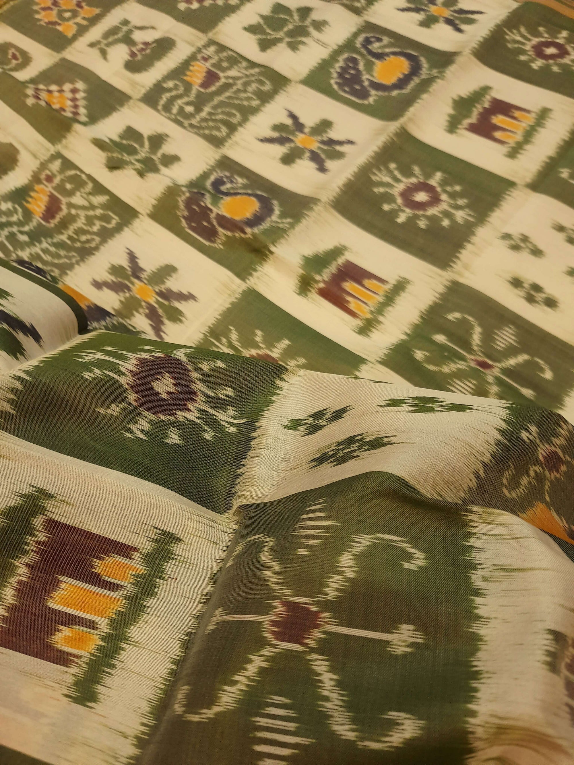 White with Green Odisha Khandua Pata Silk Saree paired with cotton ikat blouse piece