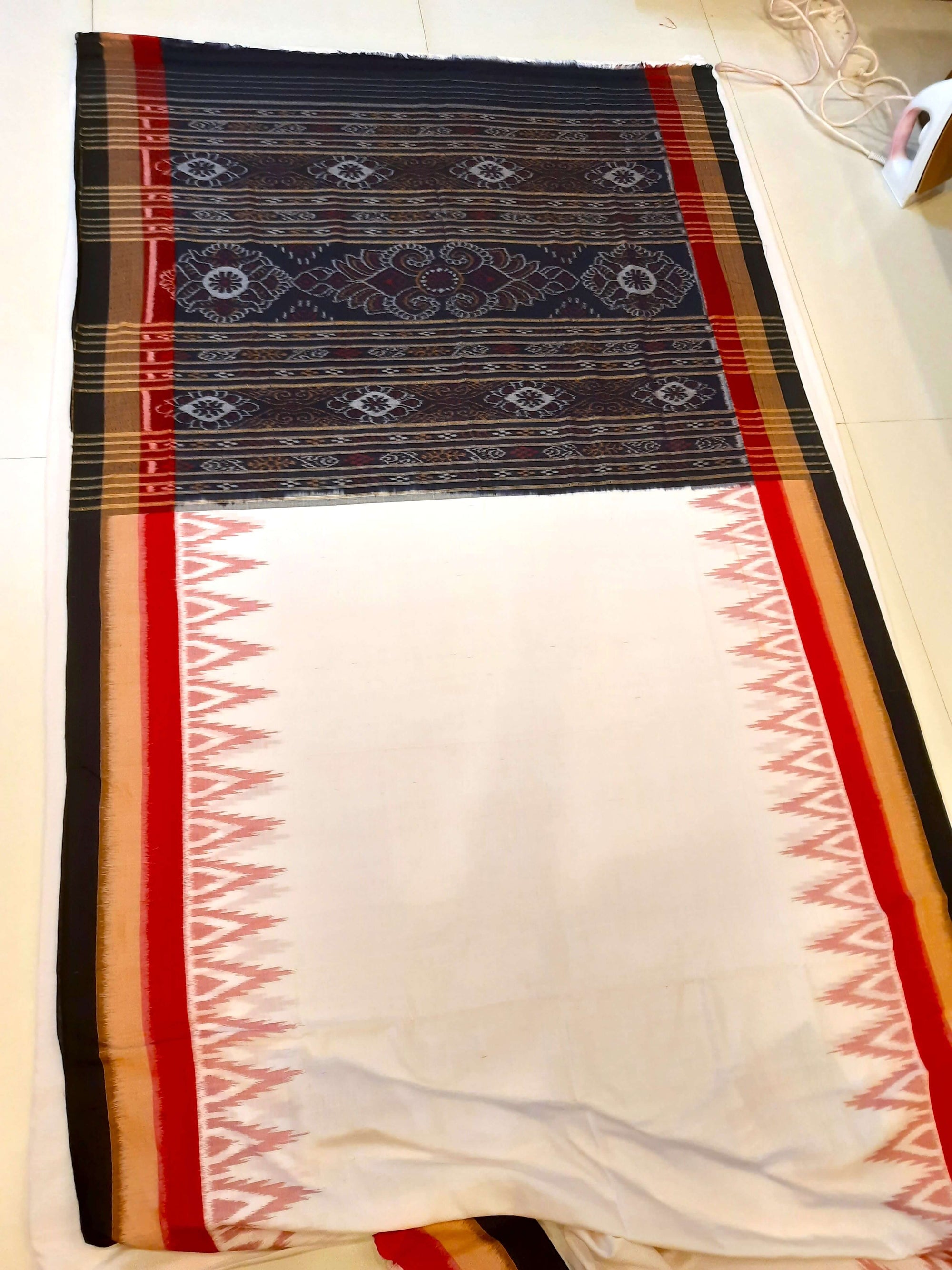 White multi coloured border Odisha Ikat saree with running blouse piece