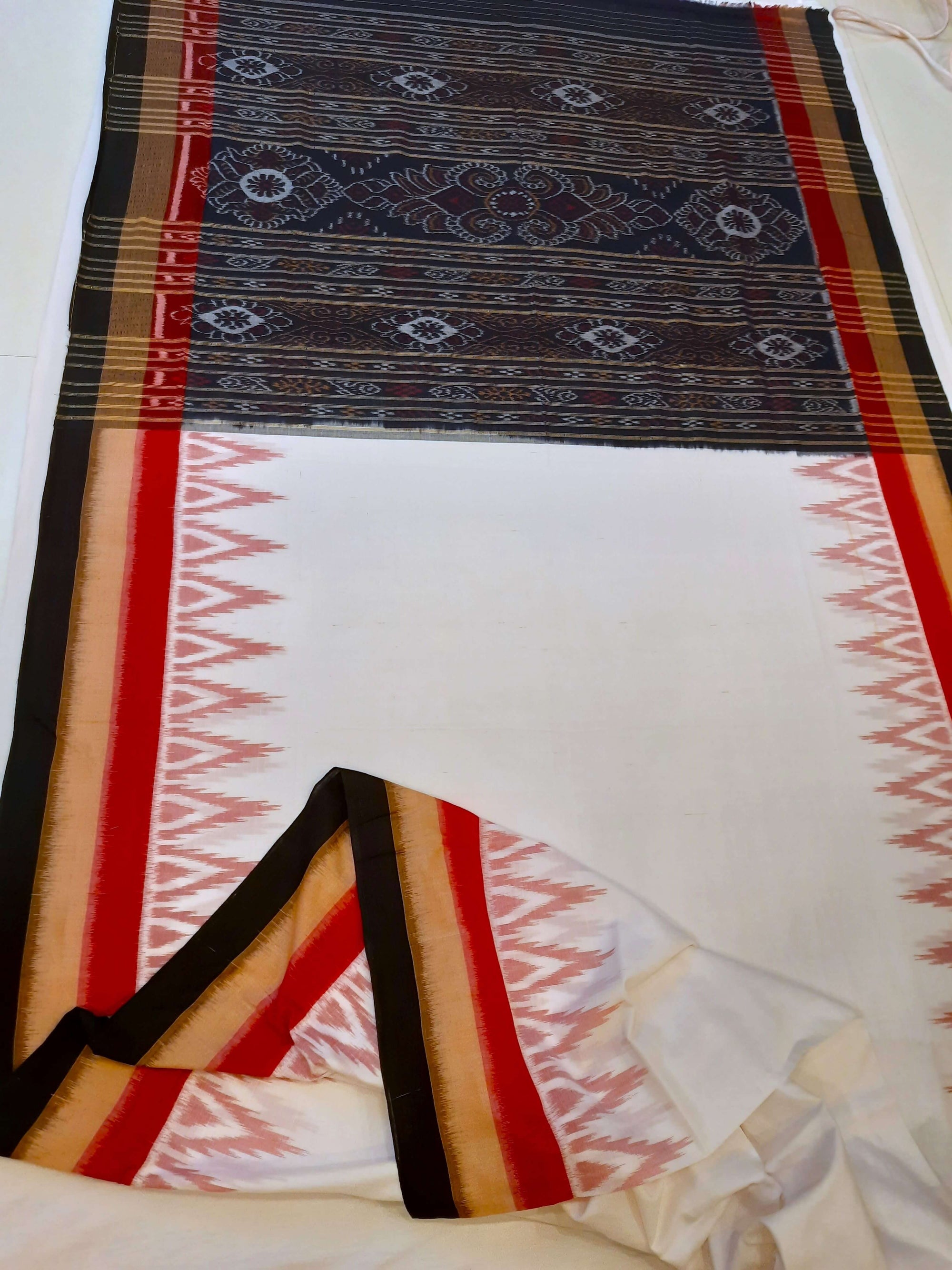 White multi coloured border Odisha Ikat saree with running blouse piece