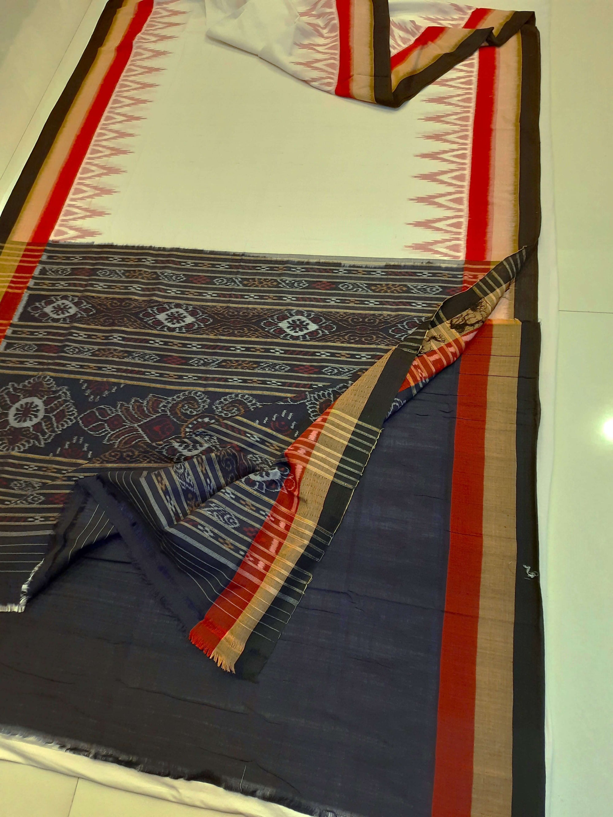 White multi coloured border Odisha Ikat saree with running blouse piece