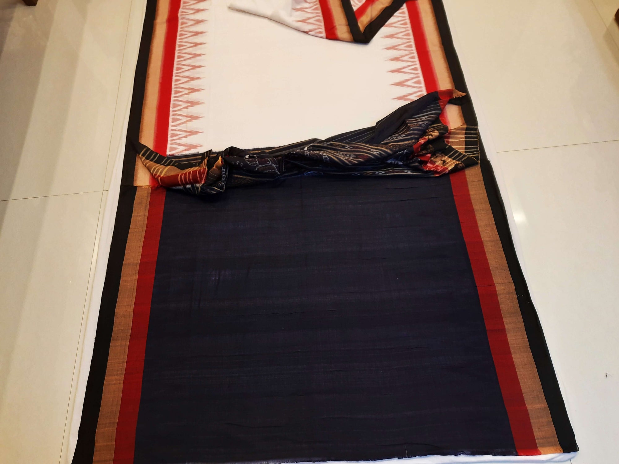 White multi coloured border Odisha Ikat saree with running blouse piece