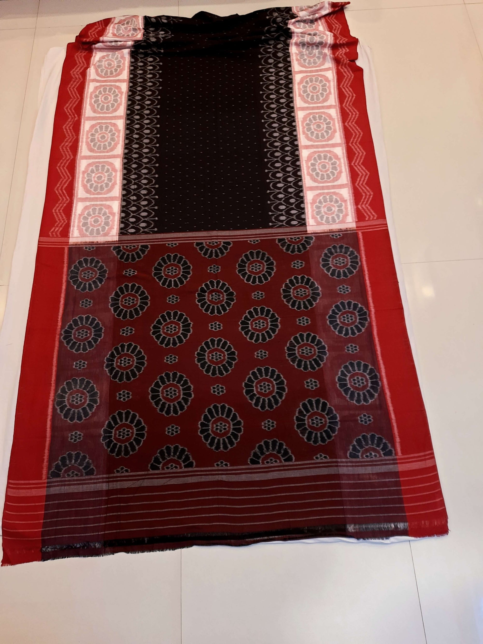 Black wide border Odisha Ikat saree with cotton ikat blouse piece