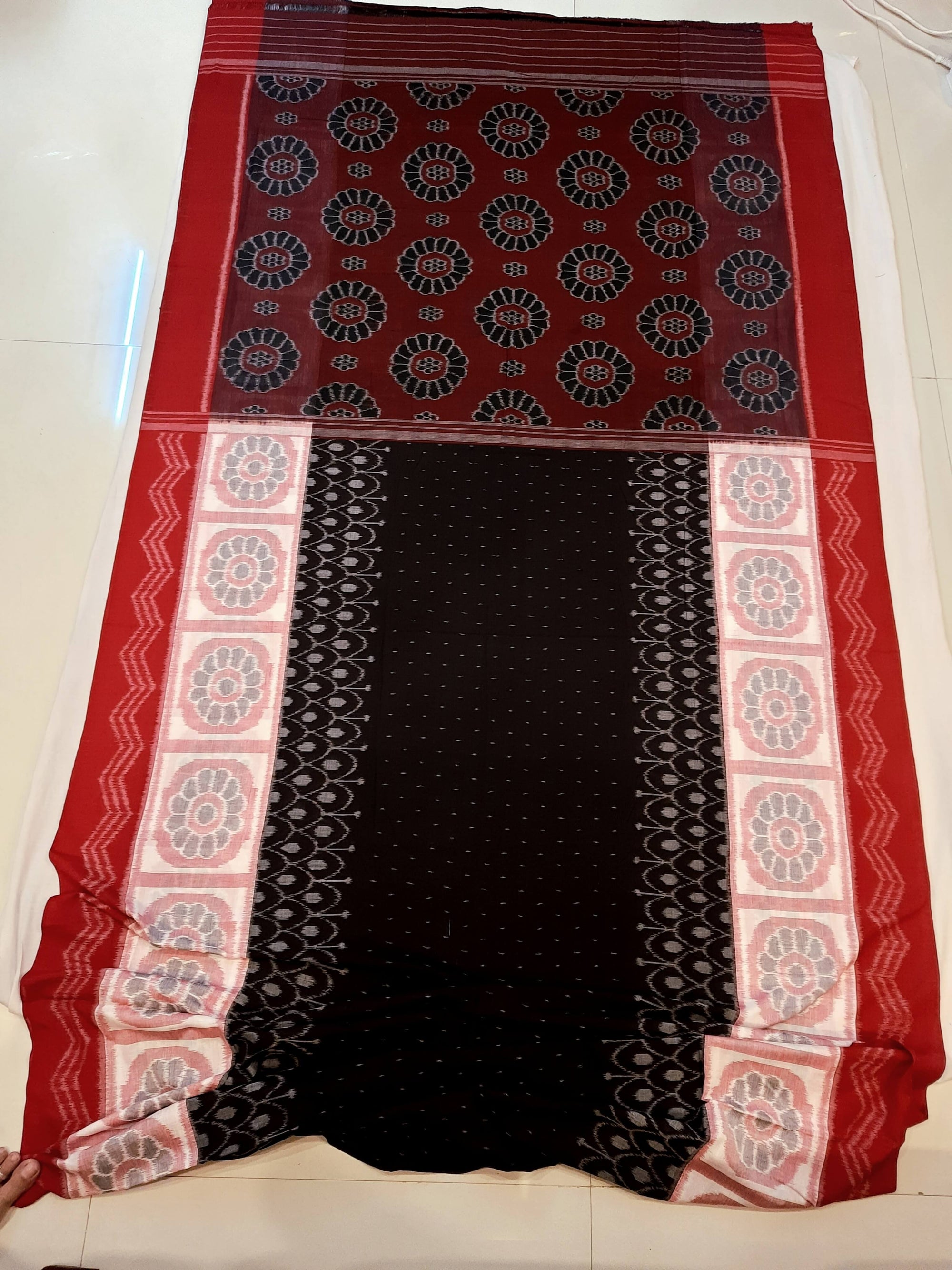 Black wide border Odisha Ikat saree with cotton ikat blouse piece