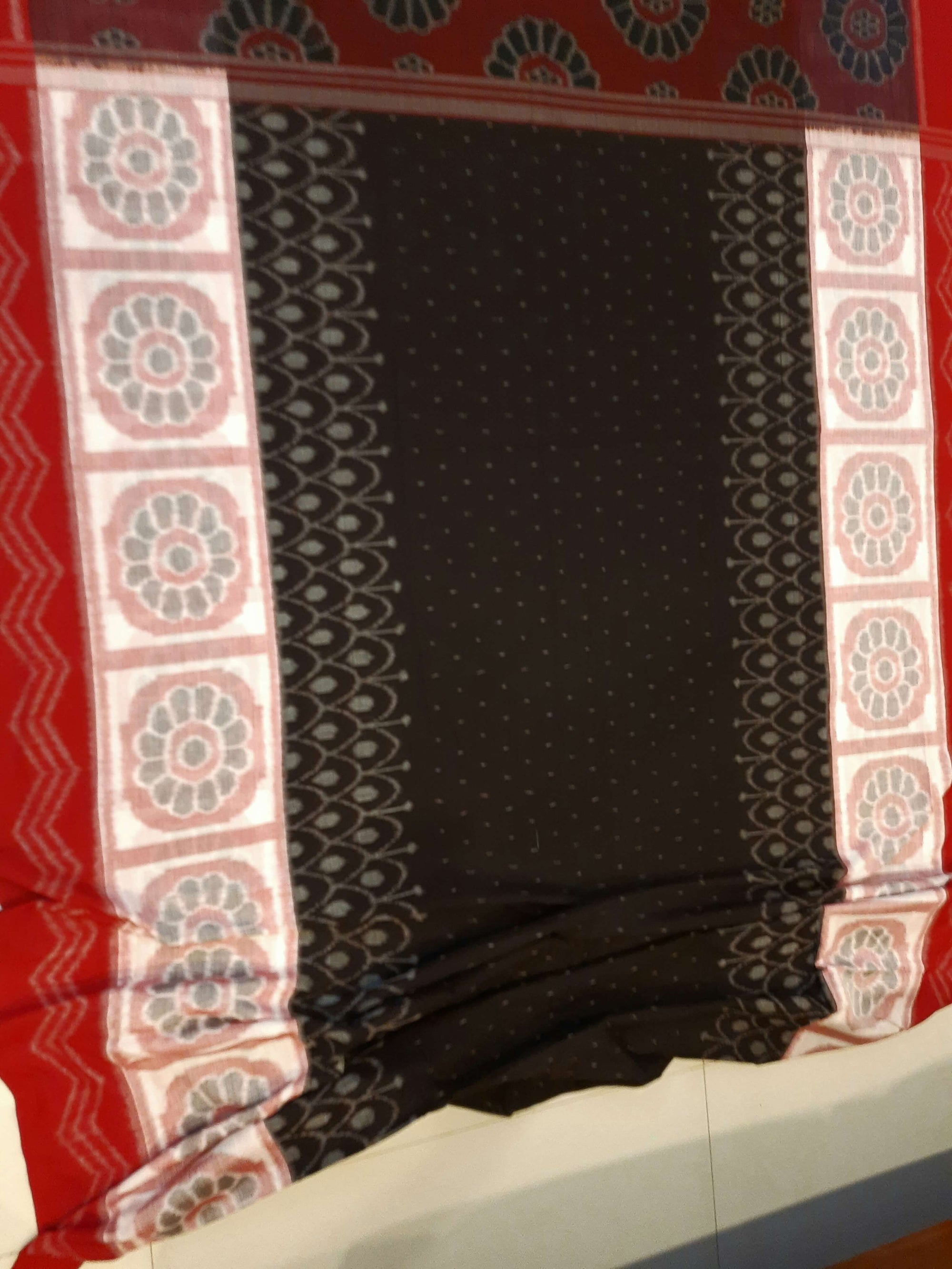 Black wide border Odisha Ikat saree with cotton ikat blouse piece