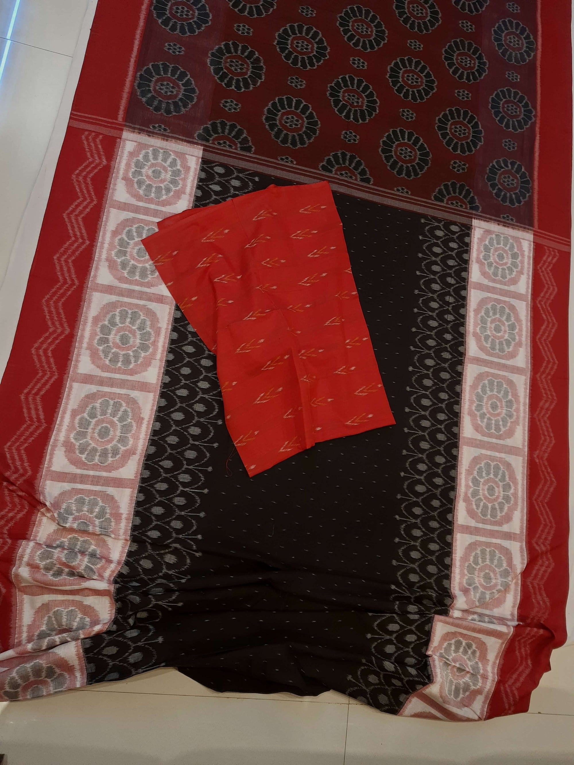 Black wide border Odisha Ikat saree with cotton ikat blouse piece
