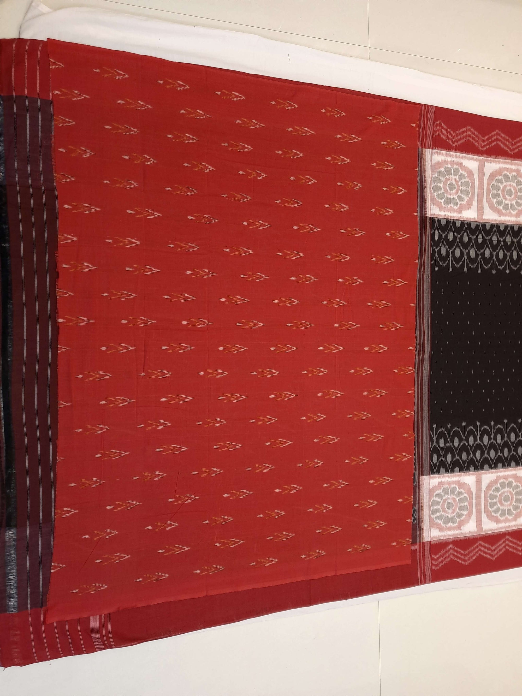 Black wide border Odisha Ikat saree with cotton ikat blouse piece
