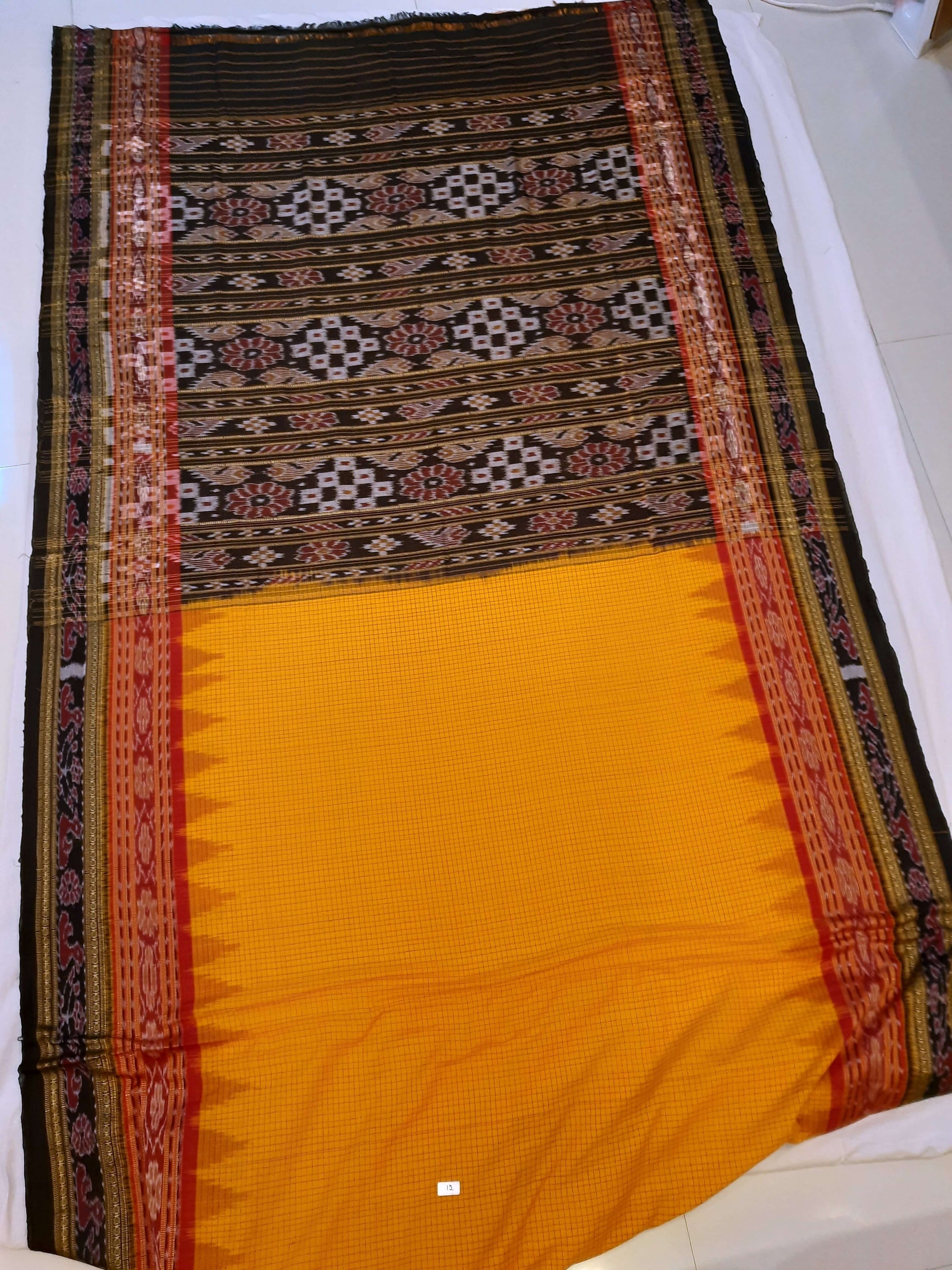 Yellow double order Sachipar Nuapatna Cotton Ikat saree with cotton ikat blouse piece