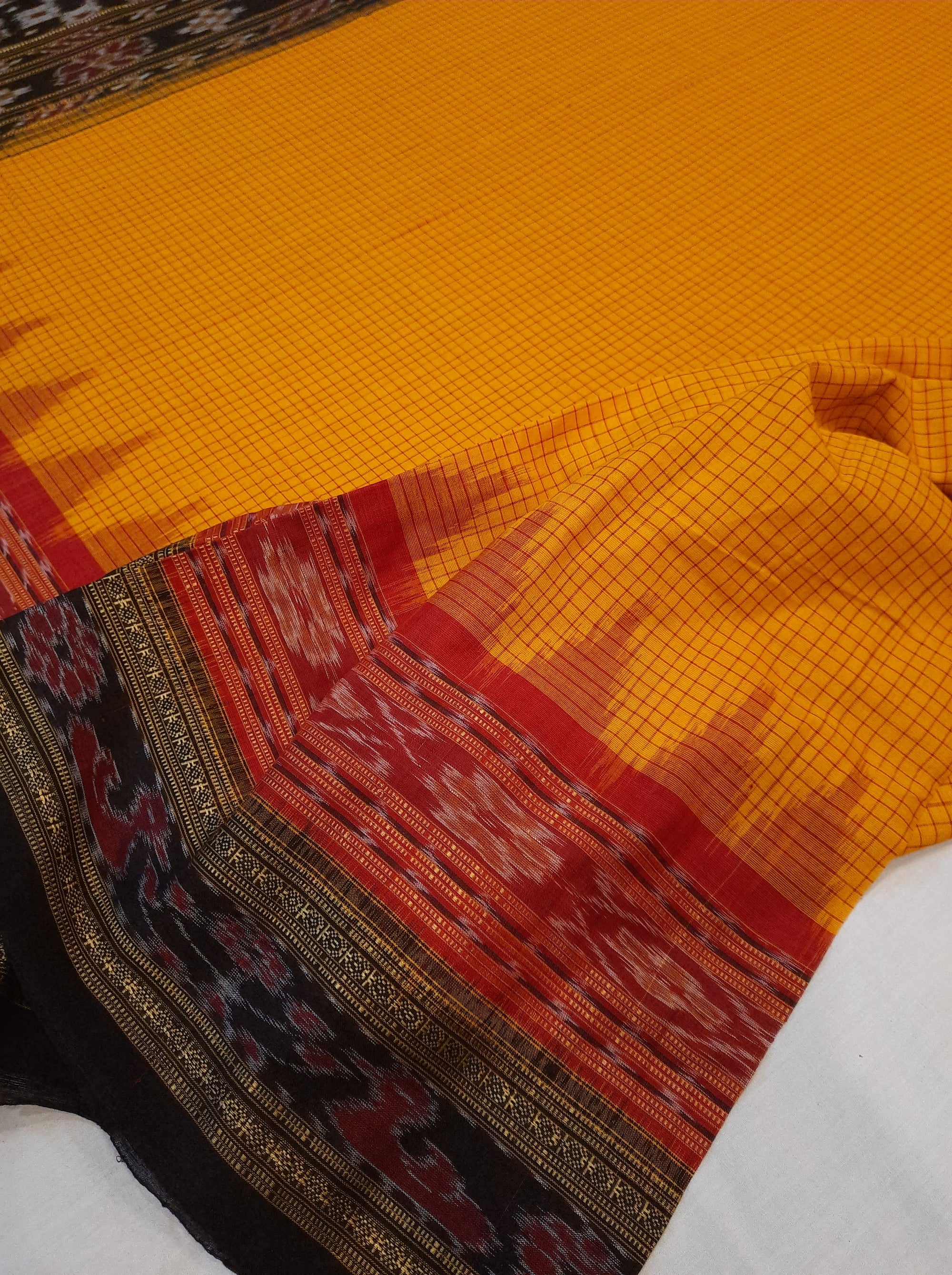 Yellow double order Sachipar Nuapatna Cotton Ikat saree with cotton ikat blouse piece