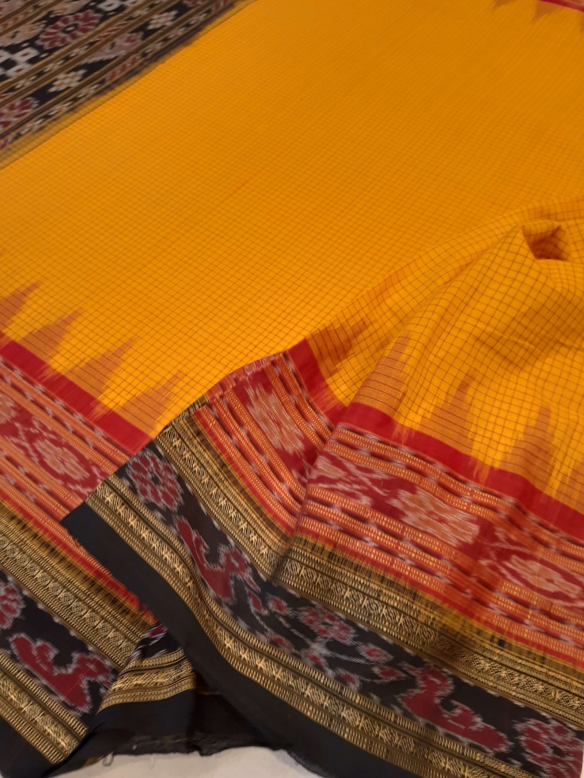 Yellow double order Sachipar Nuapatna Cotton Ikat saree with cotton ikat blouse piece