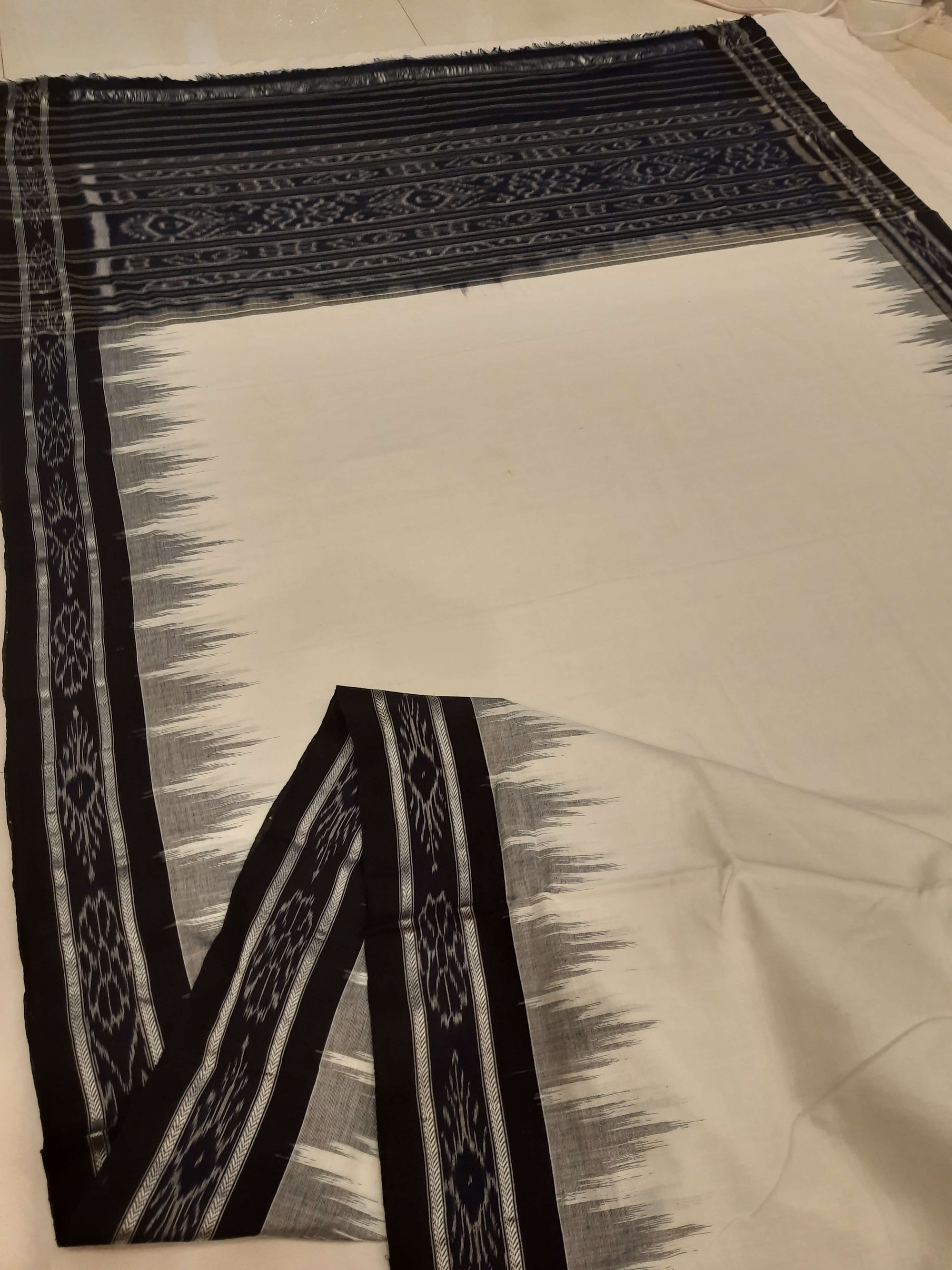 White and Black Odisha Ikat saree with cotton ikat blouse piece