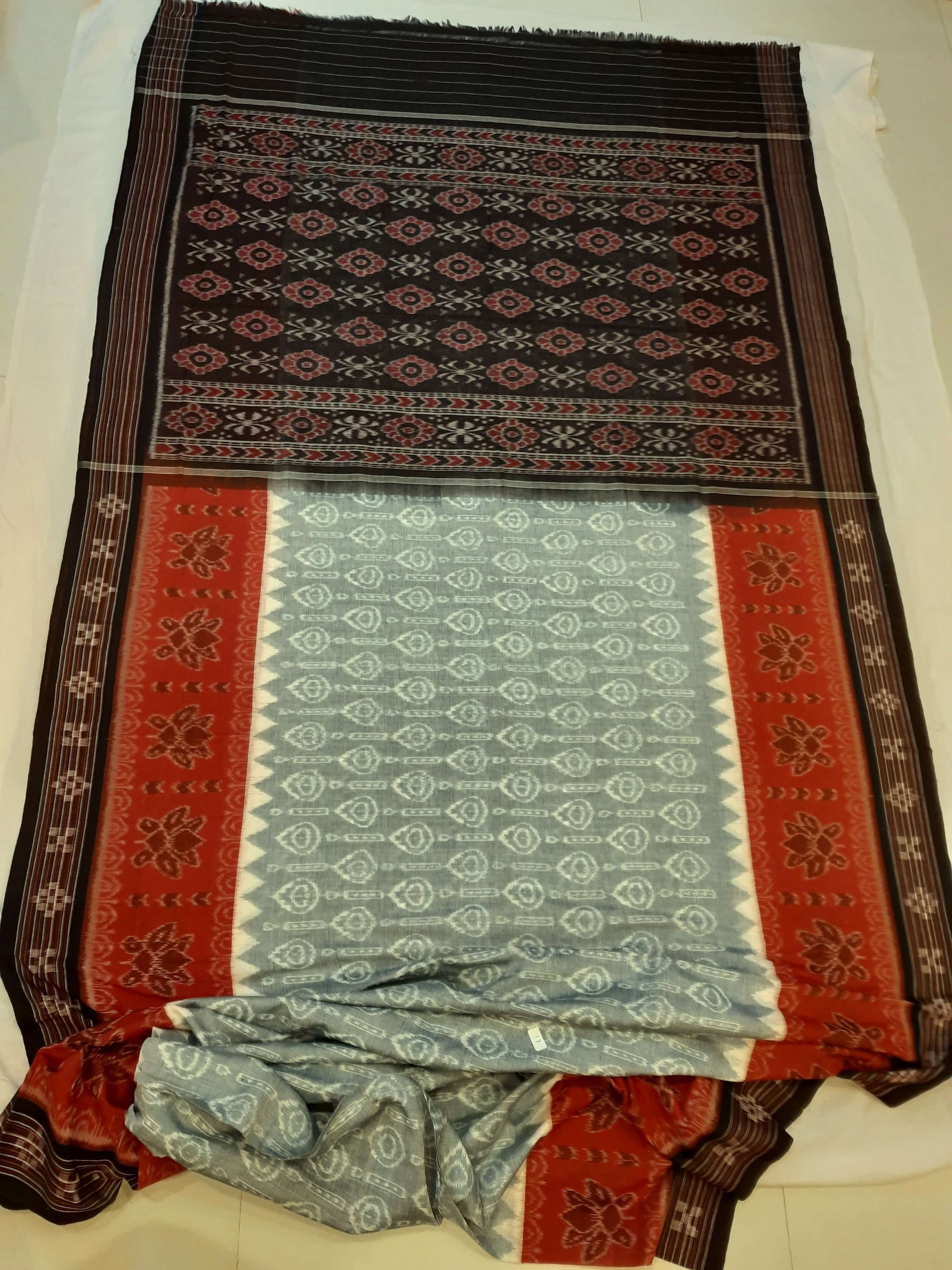 Green wide border Odisha Ikat saree with cotton ikat blouse piece